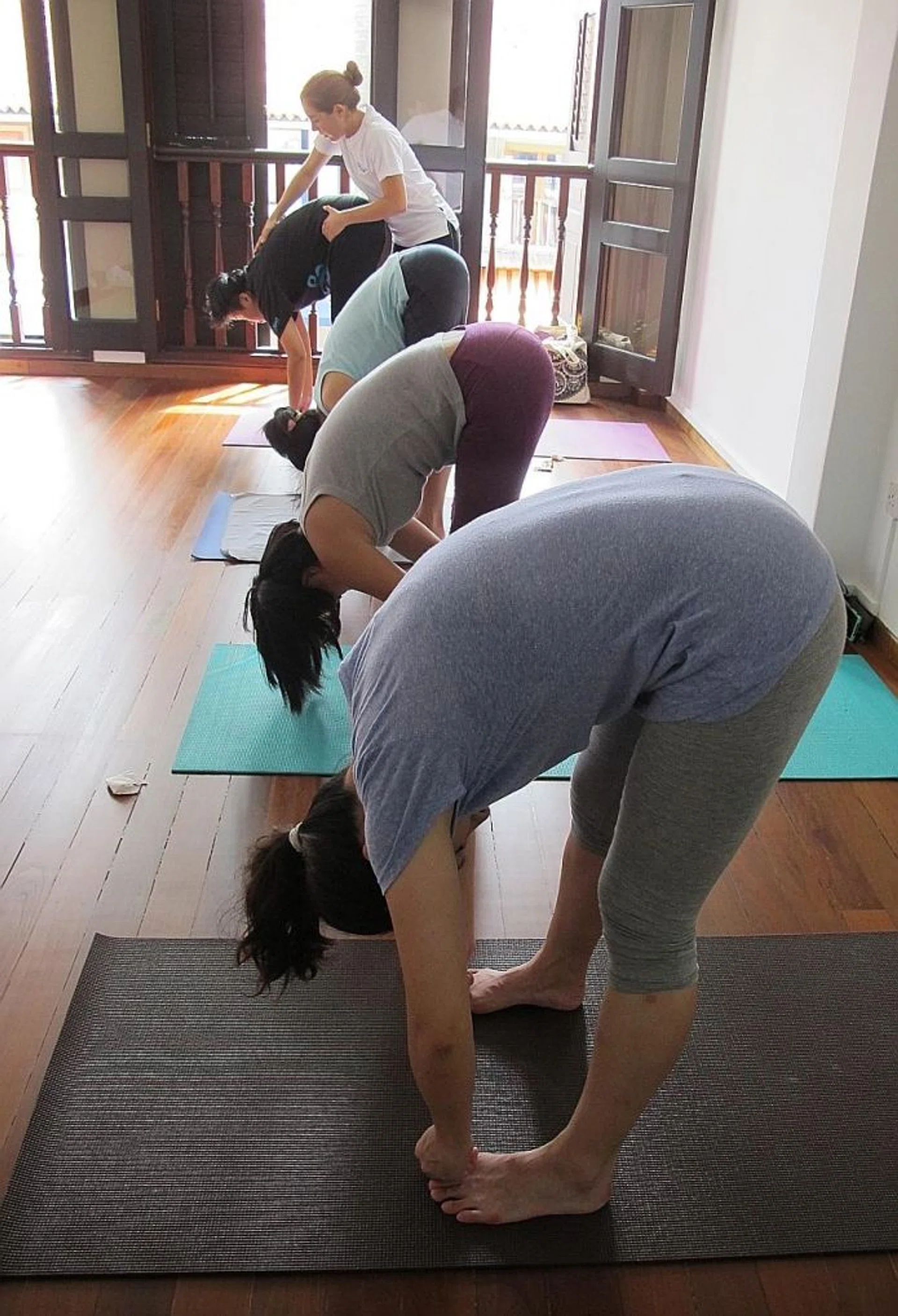 SETTLING IN: Students at OhmSantih Yoga studio are encouraged to have a relative or friend with them for the first few lessons.