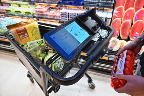 The screen on the cart enables payment without customers having to queue at physical counters.