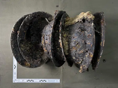 A photo, taken in a lab after the British helmets were recovered, showing how they were stacked on top of each other when found.