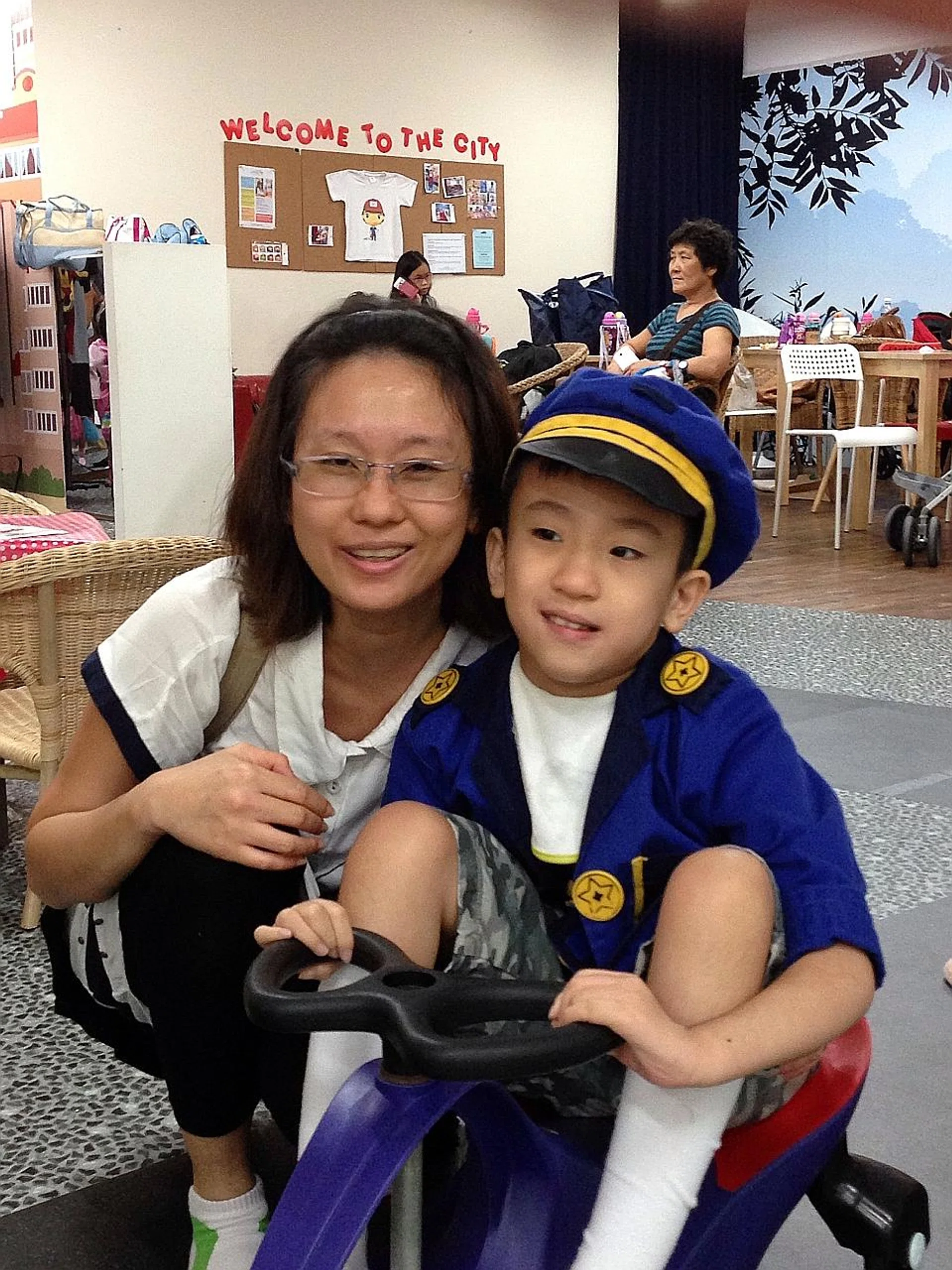 Madam Serene Poh with her son Jayden Tan. 