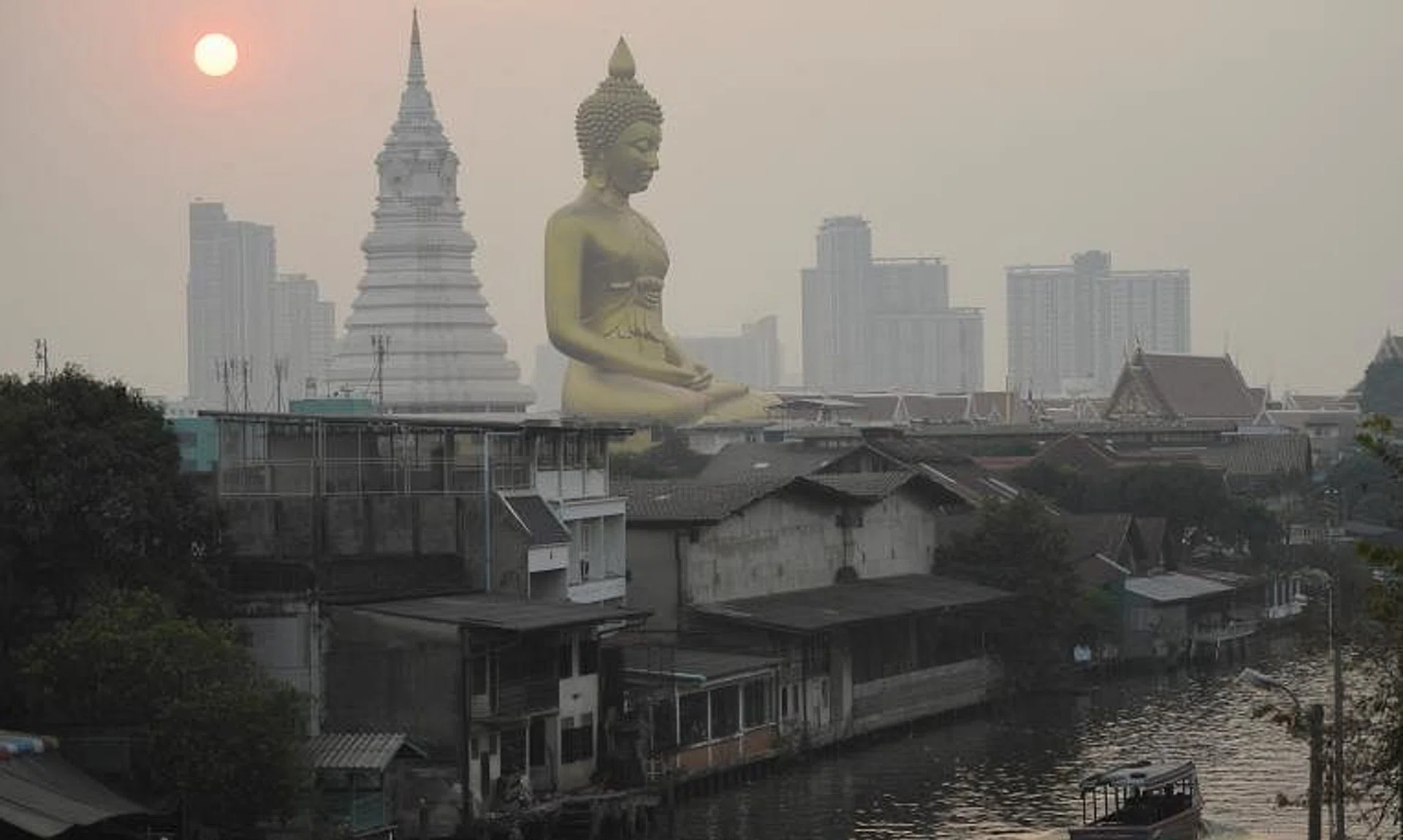 The giant Buddha statue of Wat Paknam Phasi Charoen temple is seen amid air pollution in Bangkok, on Feb 2, 2023.