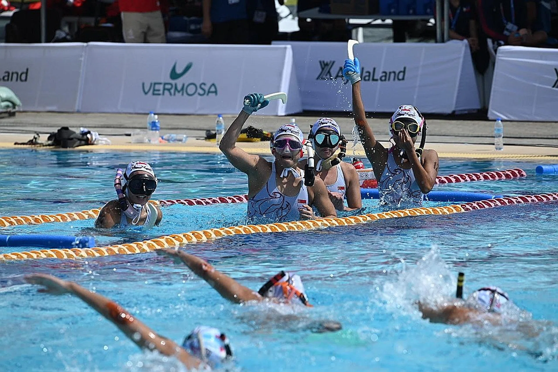 Singapore women's underwater hockey team on their way to a 4-2 win over the Philippines in the final yesterday. 