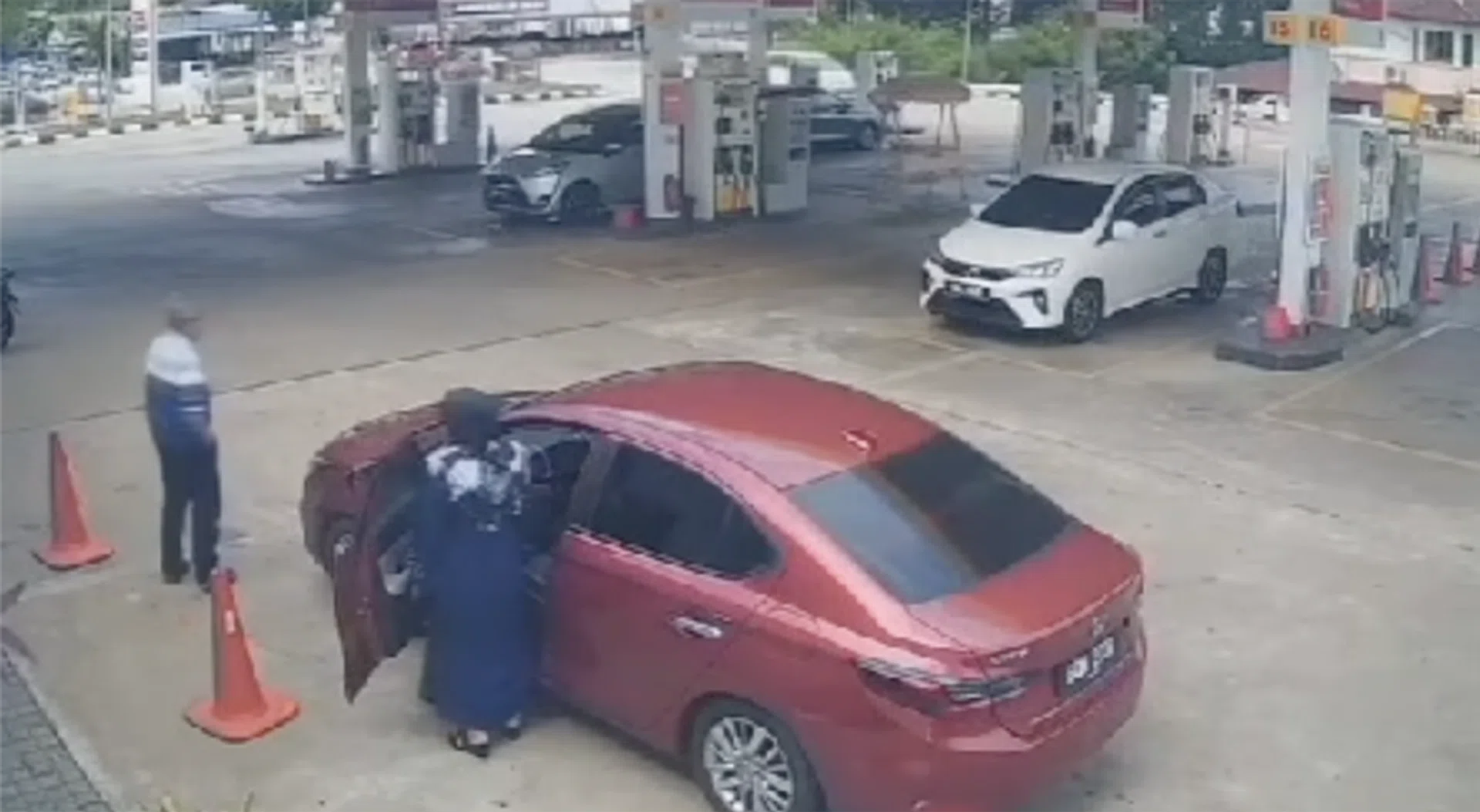 The car owner's 66-year-old mother entering the car.