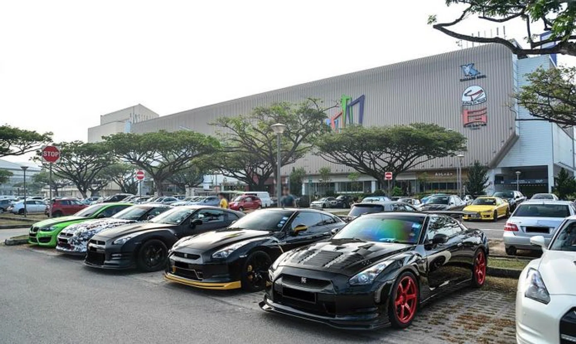DISPLAY: Supercars lined up at the carpark make it easy for enthusiasts to admire them.