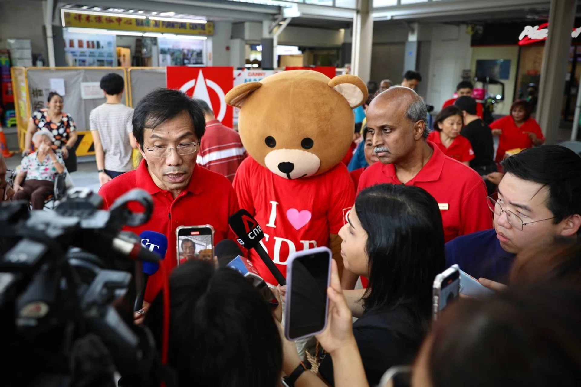 SDP party chief Chee Soon Juan and chairman Paul Tambyah speak to media at 888 Plaza in Woodlands on March 30.