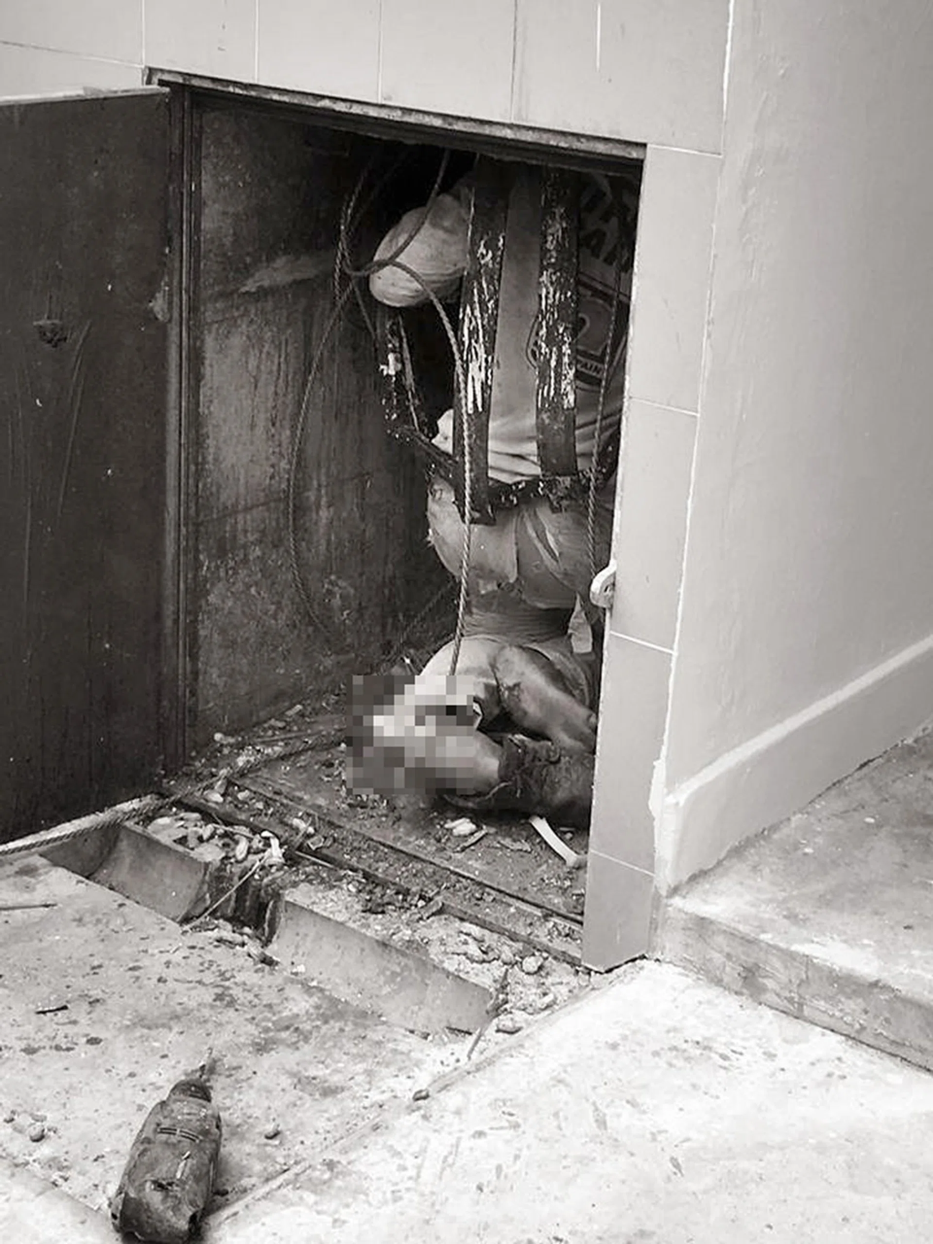 GRISLY: The worker was found injured in a rubbish chute at the ground floor of Block 8, Jalan Rumah Tinggi. 
