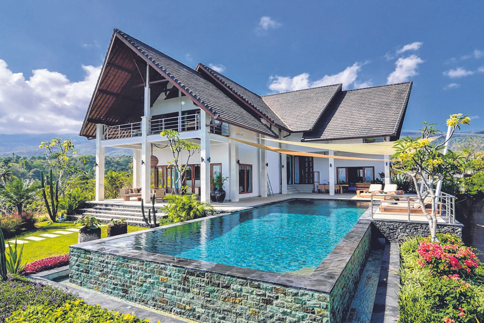 This three-bedroom Bali villa (above) and a five-bedroom Cebu hillside villa cater to big group holiday rentals. 