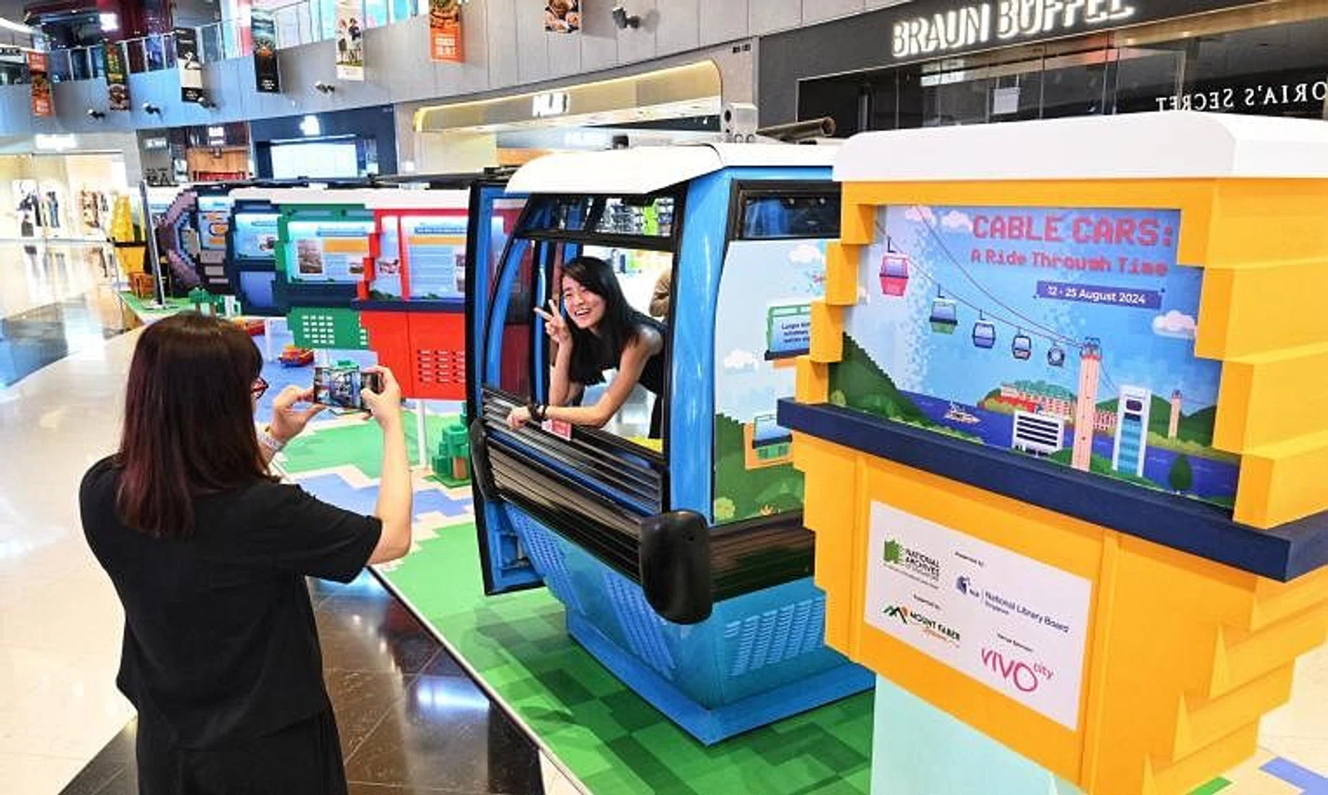 Visitors may sit inside a decommissioned second-generation cable car to experience the original journey from Mount Faber to Sentosa.