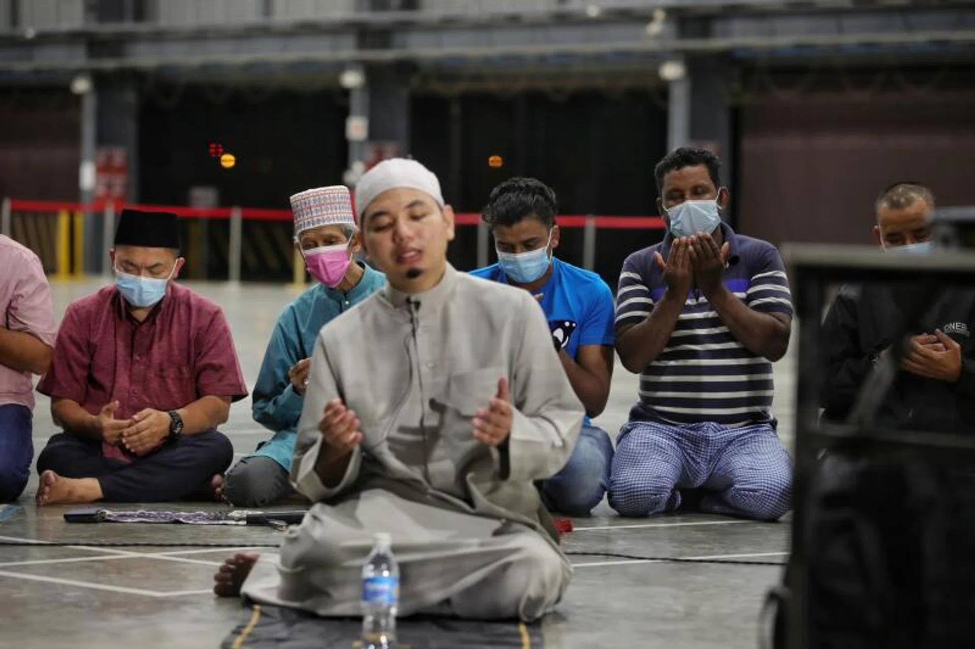 Muslim migrant workers performing their special night prayers at Kranji Recreation Centre on April 8, 2022.