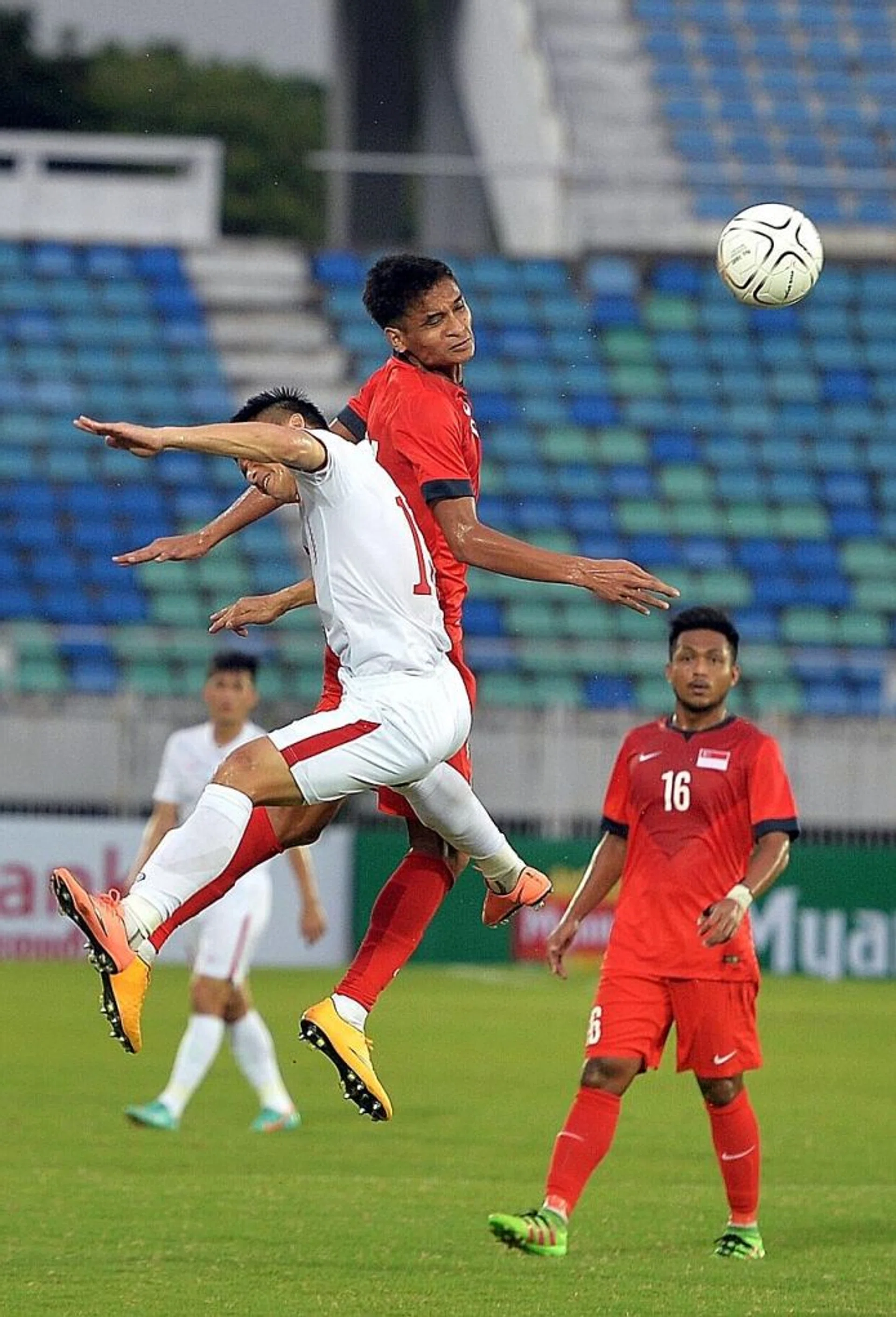 AERIAL BATTLE: Safuwan Baharudin (second from left) started as a striker but lacked support against Vietnam.