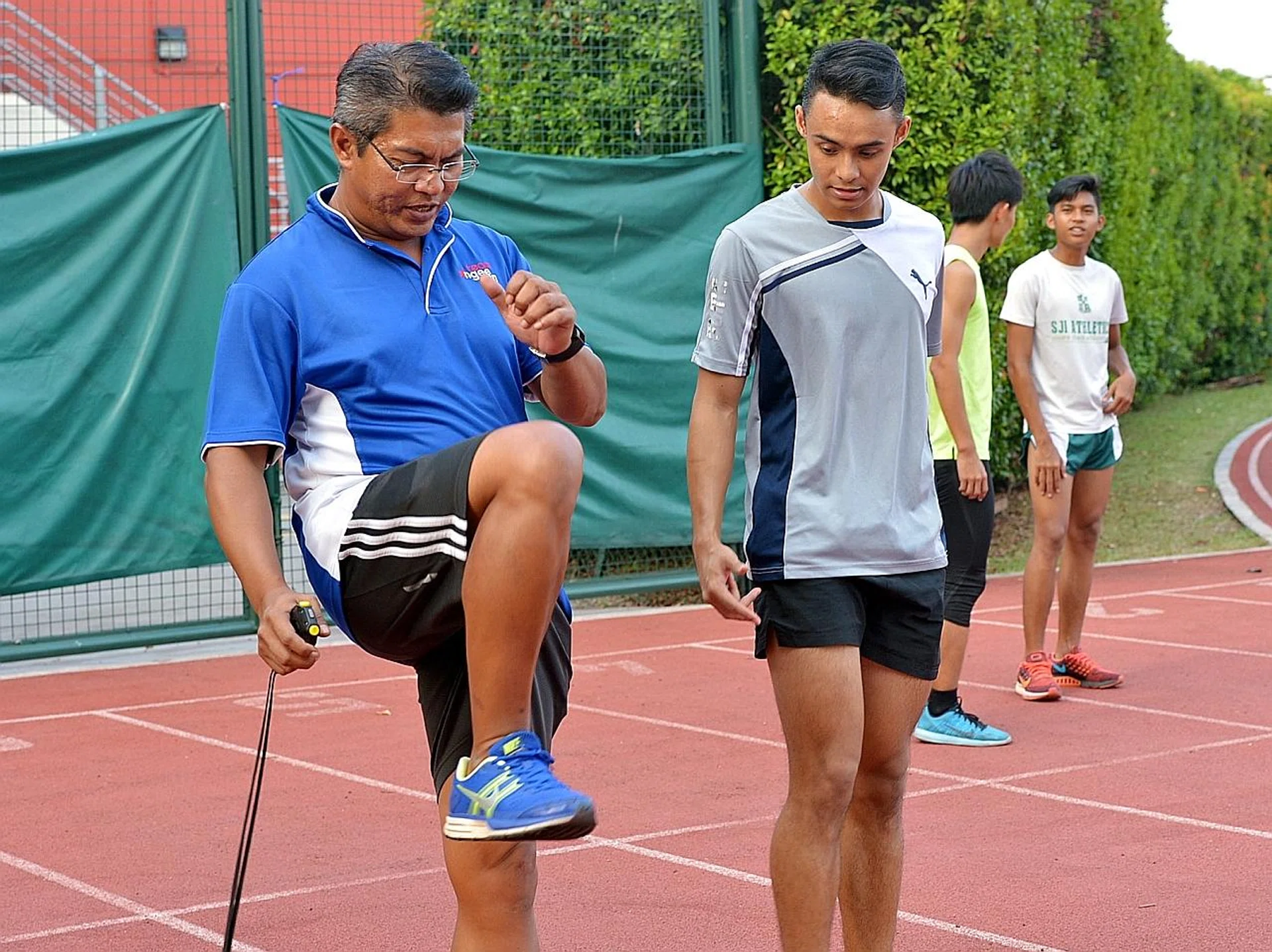 Muhamad Hosni and Suhairi Suhani during training. Hosni also coaches St Andrew's Junior College and Ngee Ann Polytechnic, among others. 