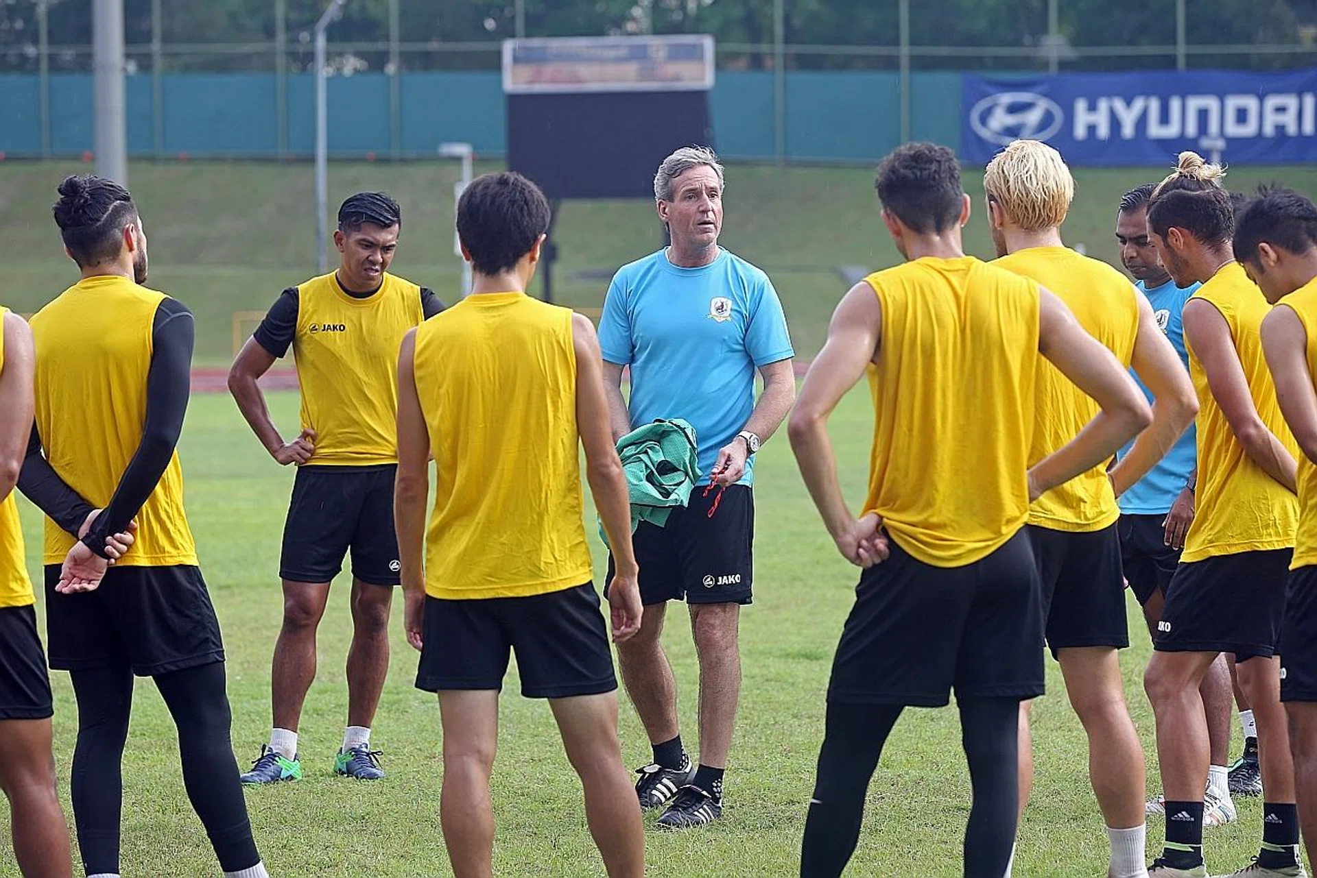 New Tampines Rovers coach Juergen Raab (centre) firmly believes the twice-a-day training sessions will help improve the Stags. 