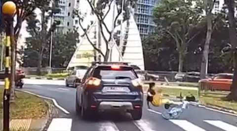 Driver fails to stop at zebra crossing, hits cyclist