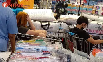 Sitting in a supermarket trolley at this age?