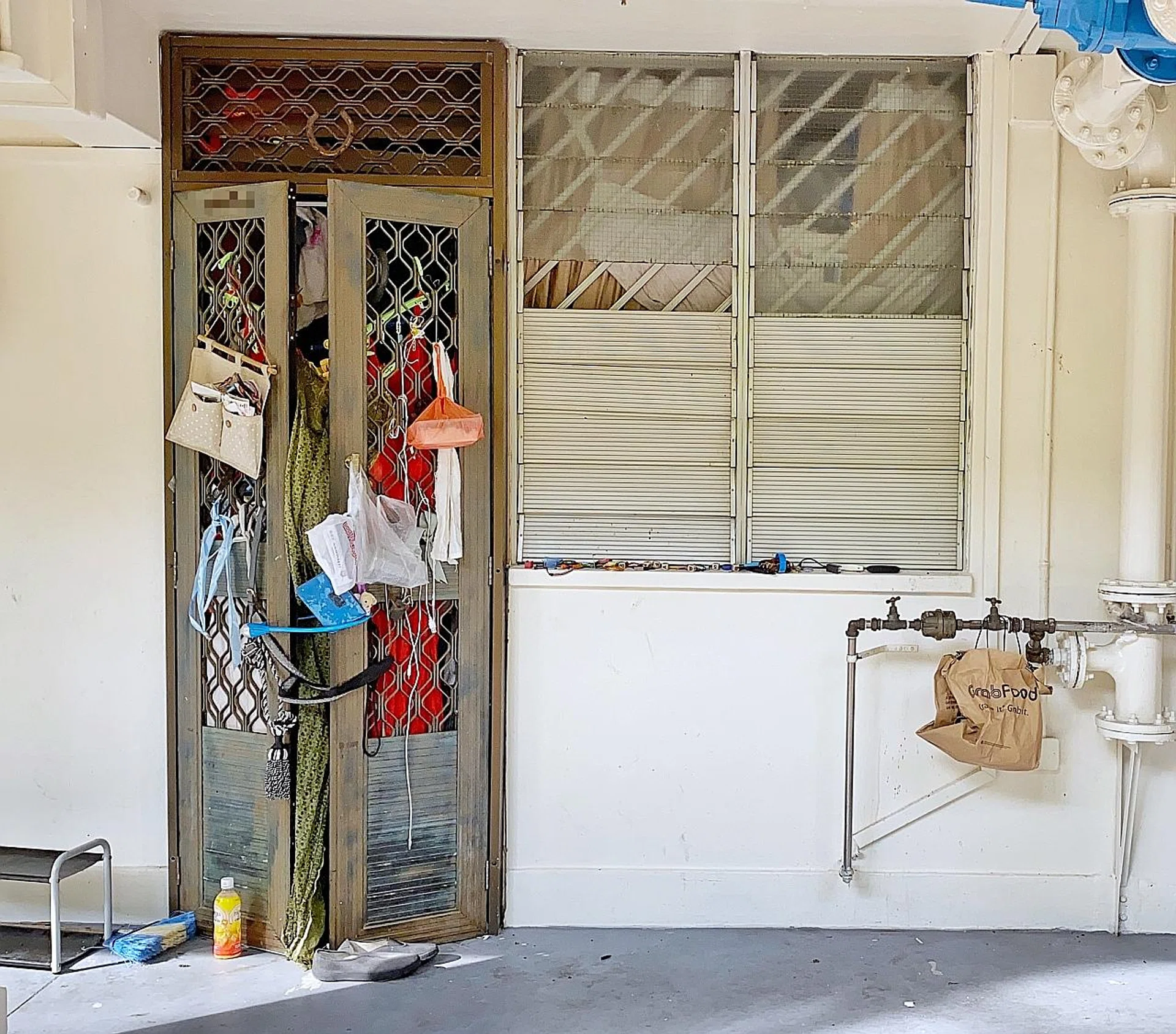 Ms Zhu's ground floor unit in Block 100 Commonwealth Crescent is overflowing with junk, causing neighbours to be concerned about her safety and their own.