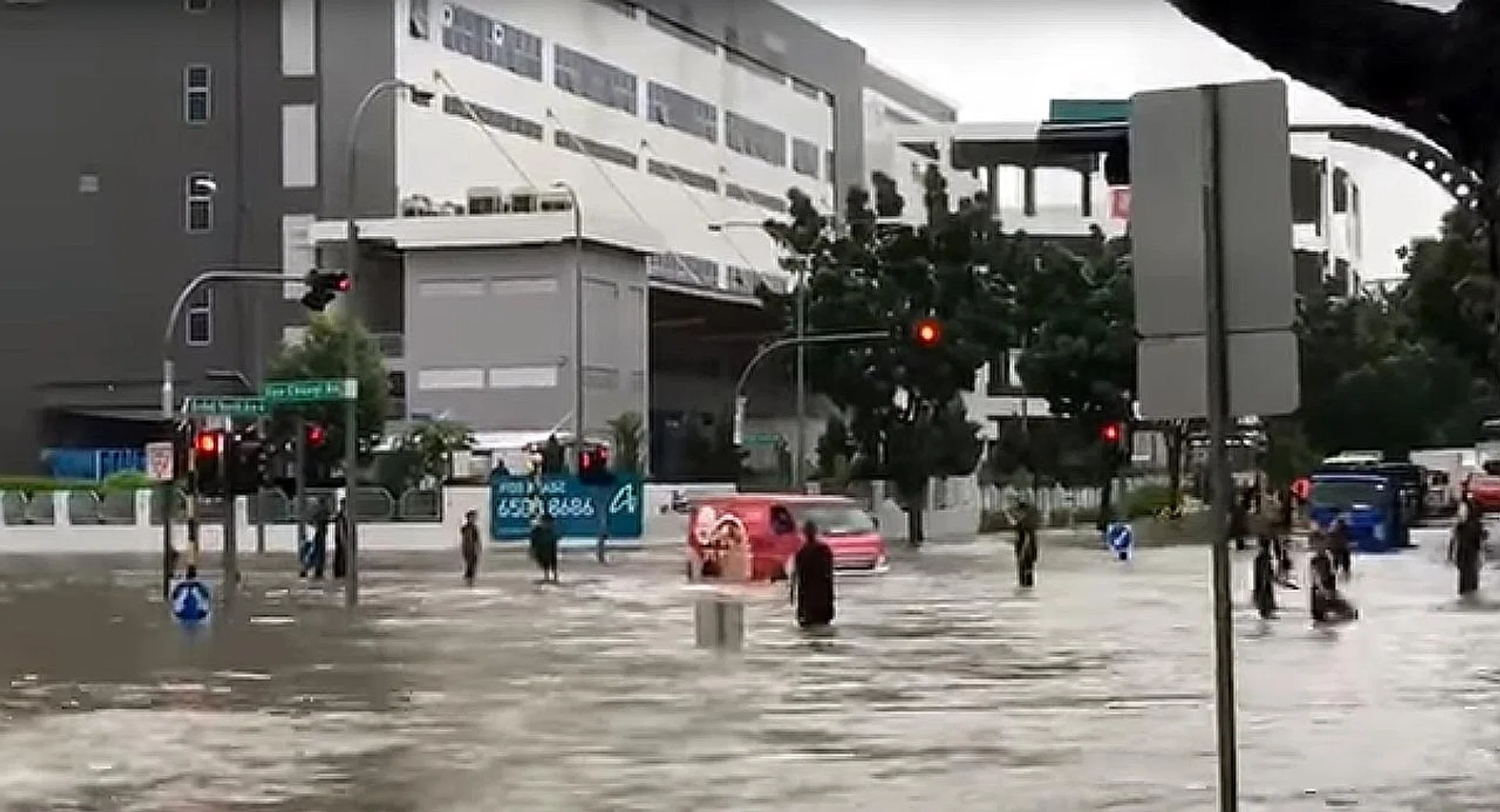 Pedestrians and motorists in Upper Changi had to deal with flooding after torrential rain in eastern Singapore. 