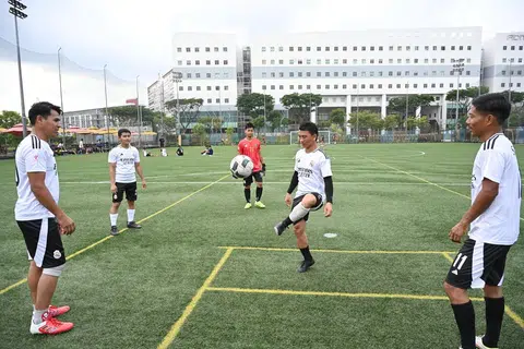 Mr Than Zaw, 26 (second from left), playing football at Cochrane Recreation Centre on Feb 16 with other migrant workers from Myanmar who also live in Cochrane Lodge 2 in Sembawang.