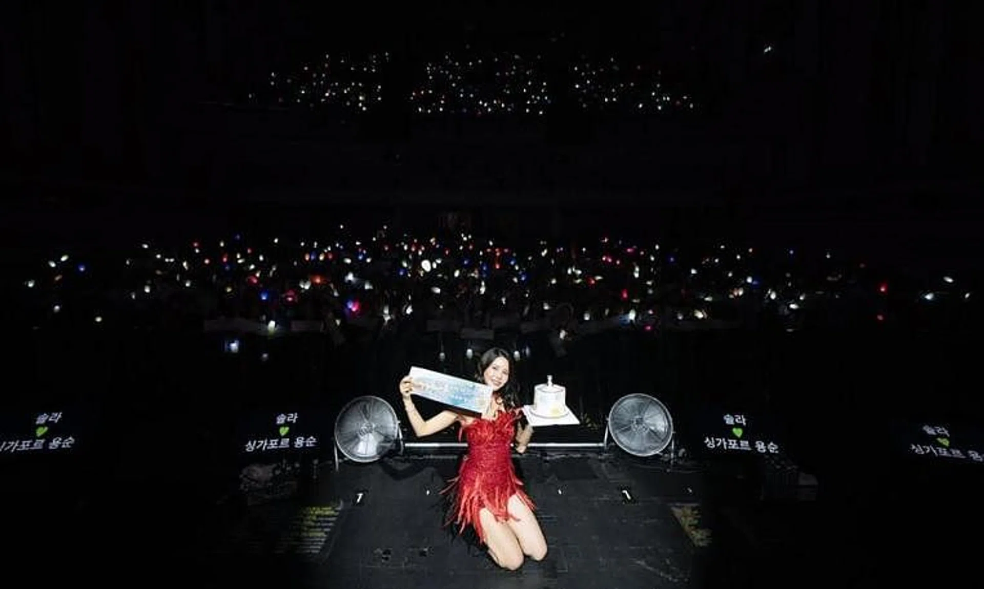 K-pop idol Solar poses with fans at the Capitol Theatre on July 27 during her concert in Singapore.