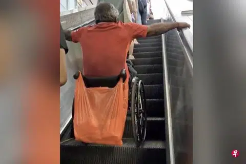 Man in wheelchair rides MRT escalator unaided, sparking safety concerns