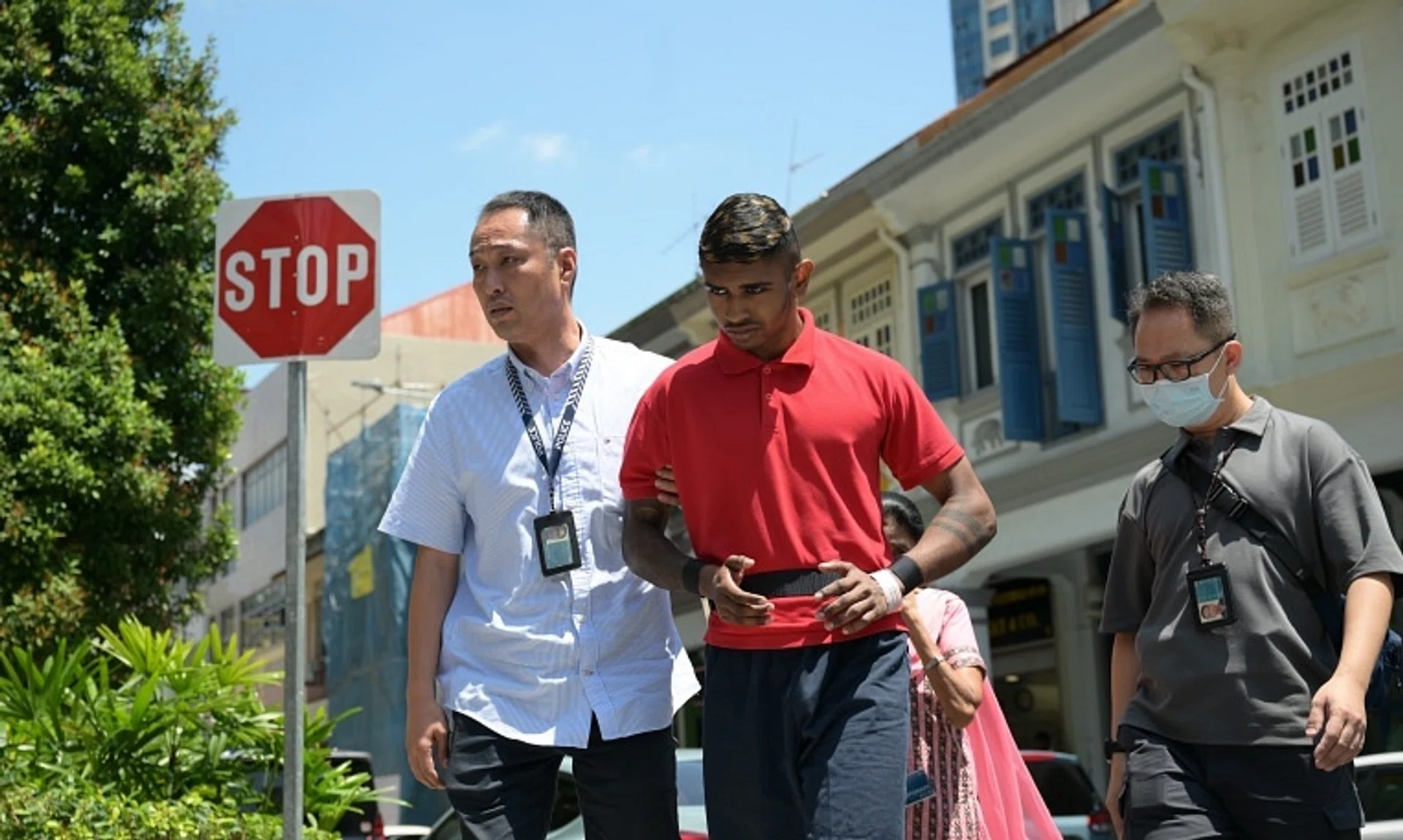 At around 11.45am, Muhammad Sajid Saleem arrived in an unmarked vehicle in handcuffs and was escorted by four police officers.