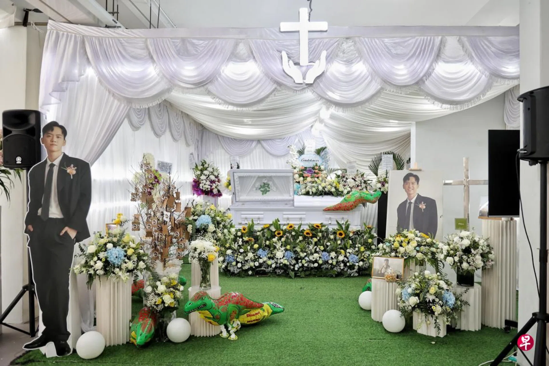 A standee of Nathaniel Zachariah Tan in his wedding suit was placed at his funeral wake. 