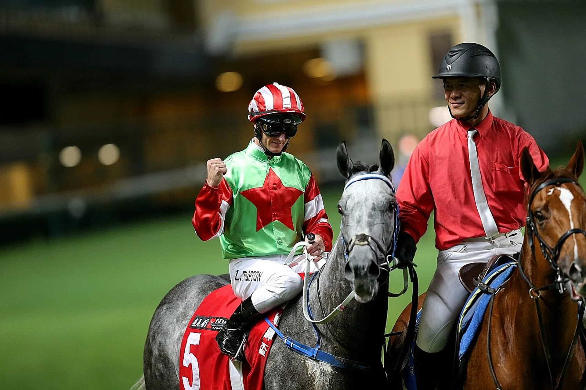 Jockey Zac Purton aboard Guy Dragon, his fourth winner of the night at Happy Valley on Wednesday. 