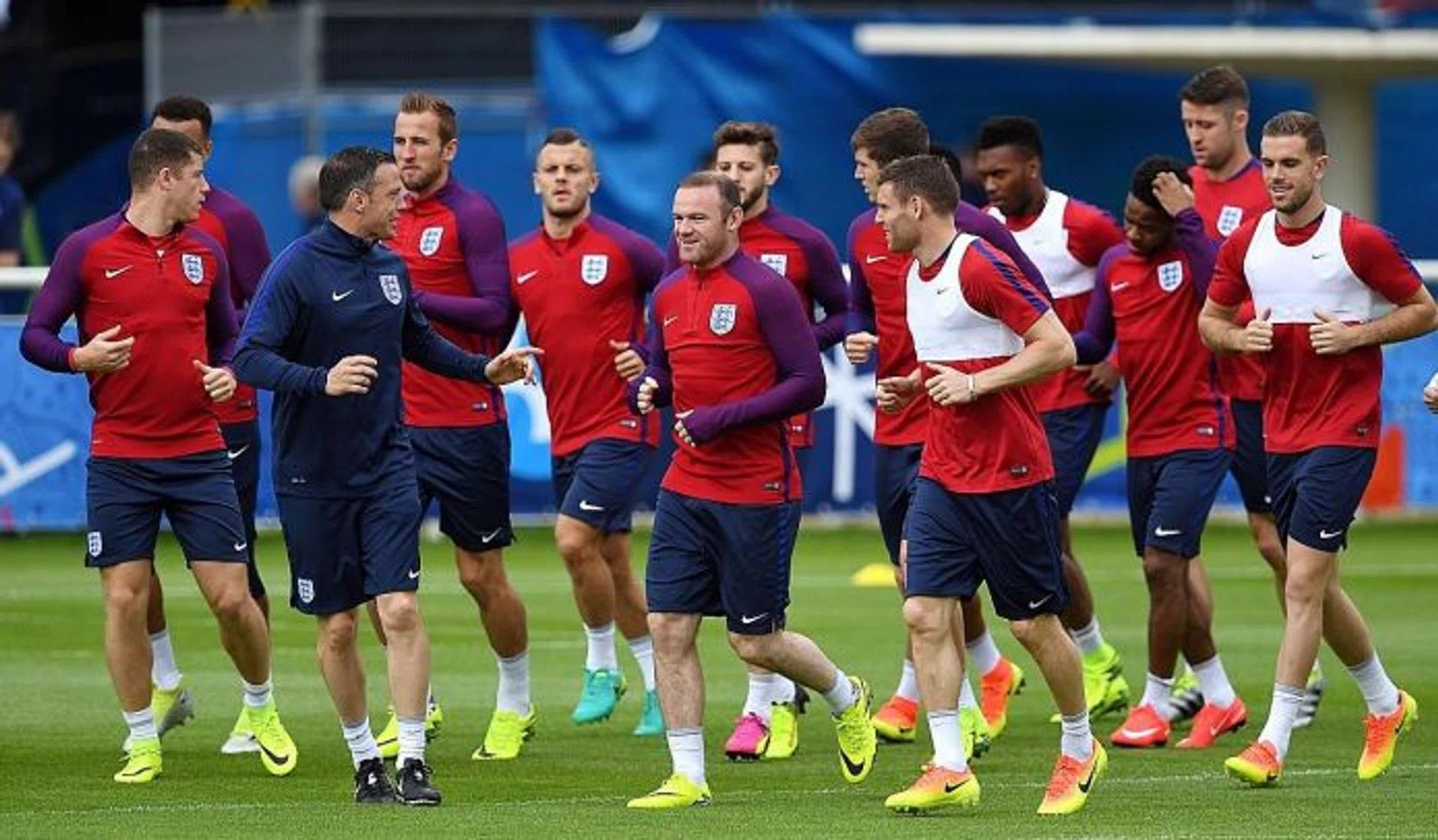 LEADER: England skipper Wayne Rooney (centre) takes the Three Lions on a training sesssion.