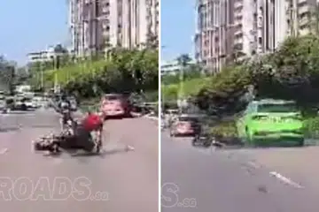 Motorcycle skids, gets dragged by taxi on PIE