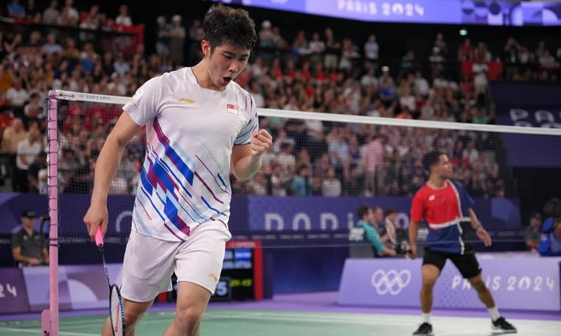 Singaporean shuttler Loh Kean Yew in action against Uriel Canjura of El Salvador.