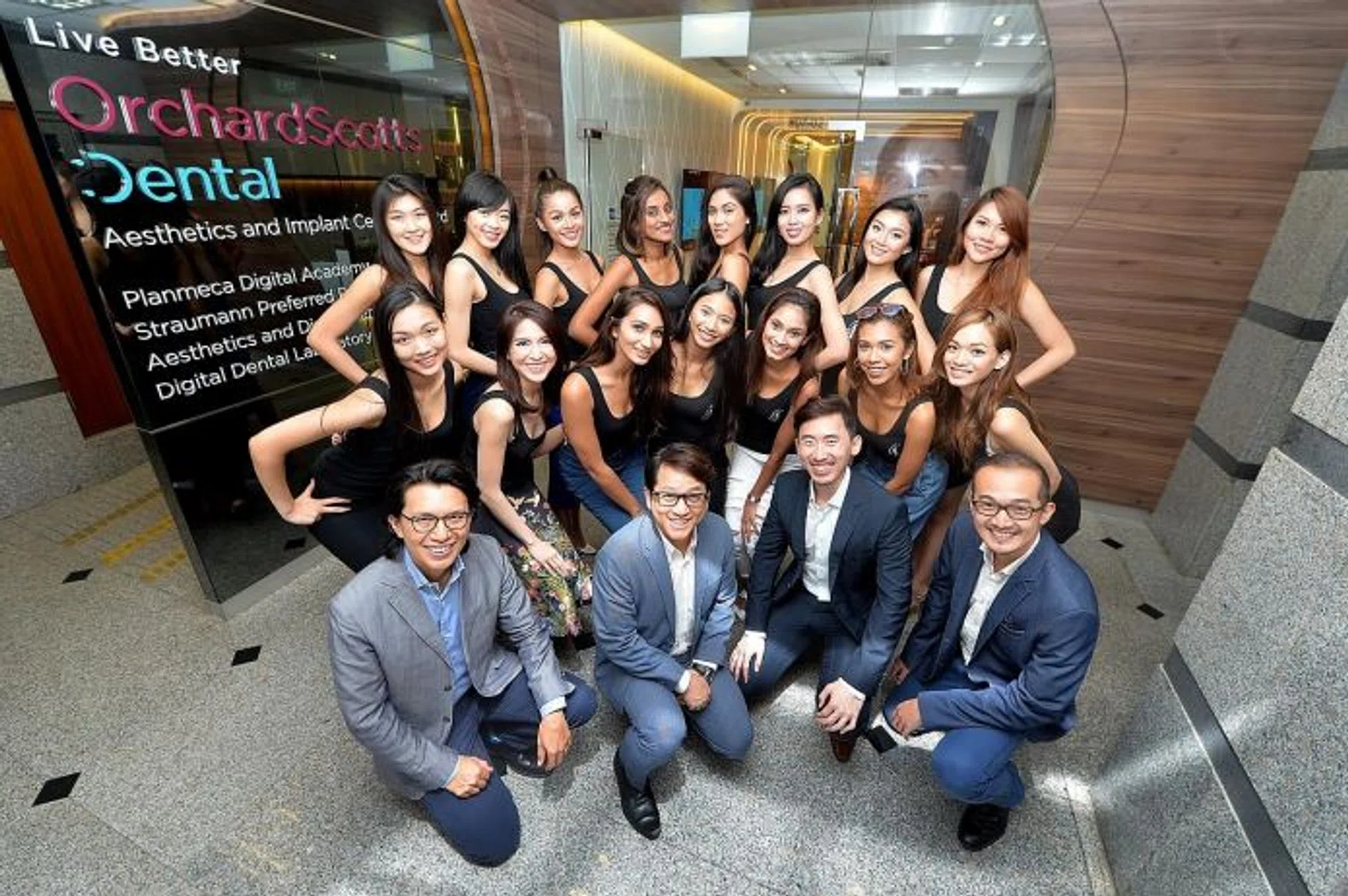ALL SMILES: The MUS finalists at Orchard Scotts Dental.  First row, from left: Dr Ronnie Tay, Dr Jerry Lim, Dr Kenneth Tan, Dr Kelvin Chua.  Second row, from left: Hazel Tay, Shona Woo, Nutan Rai, Tanisha Khan, Poojaa Gill, Shanice Hedger, Nikki Tay.  Third row, from left: Althea Lew, Joeypink Lai, Patricia Eng, S. Sreeveena, Sonya Branson, Luisa Gan, Cheryl Chou, Vanessa Tay