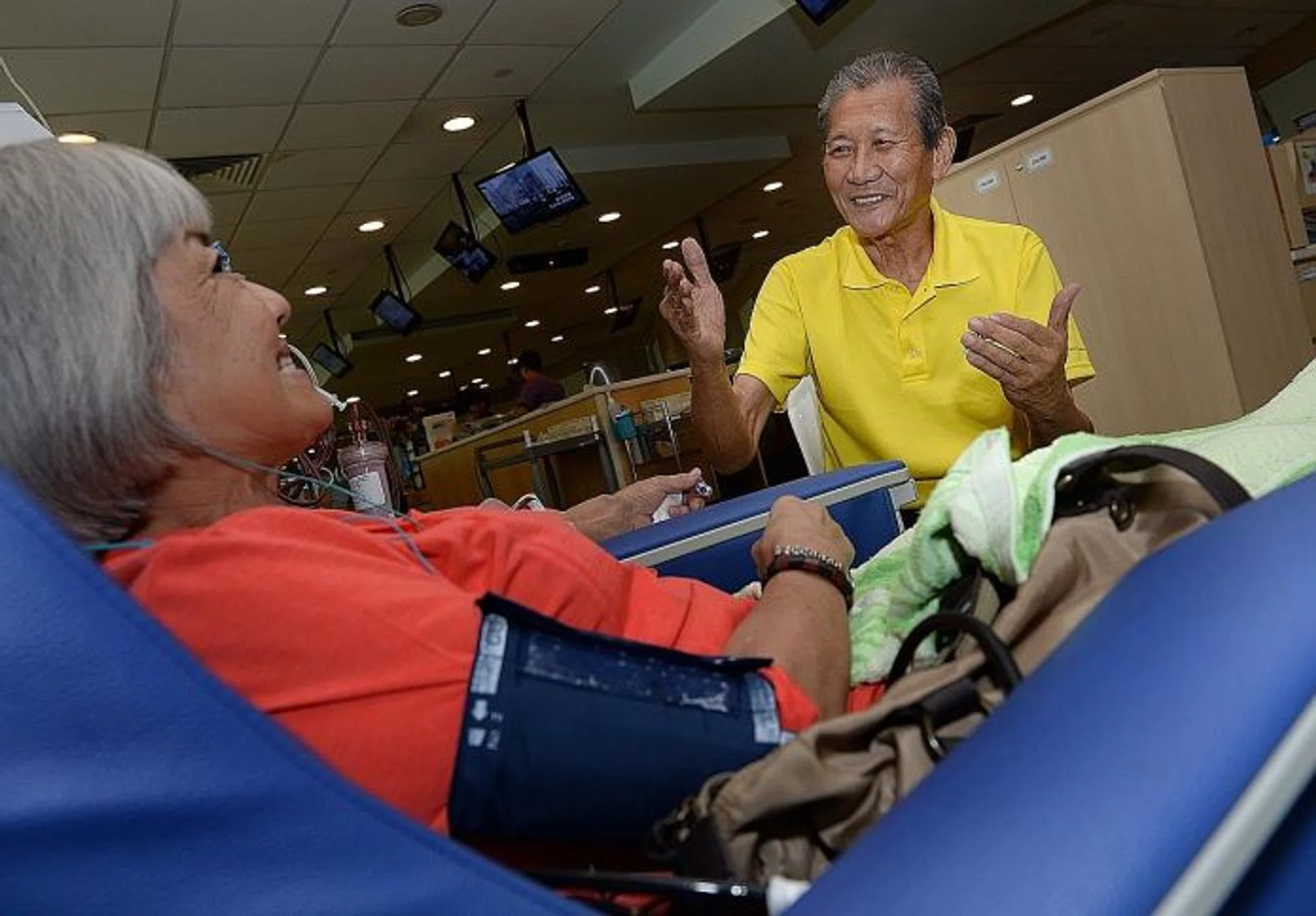 SHOCKED: Dialysis patient Joseph Chan (right) broke down in tears when he heard the news of Mr Edmund Kwok's sacking. 
