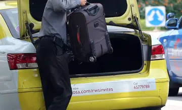 Man jailed for punching cabby over luggage