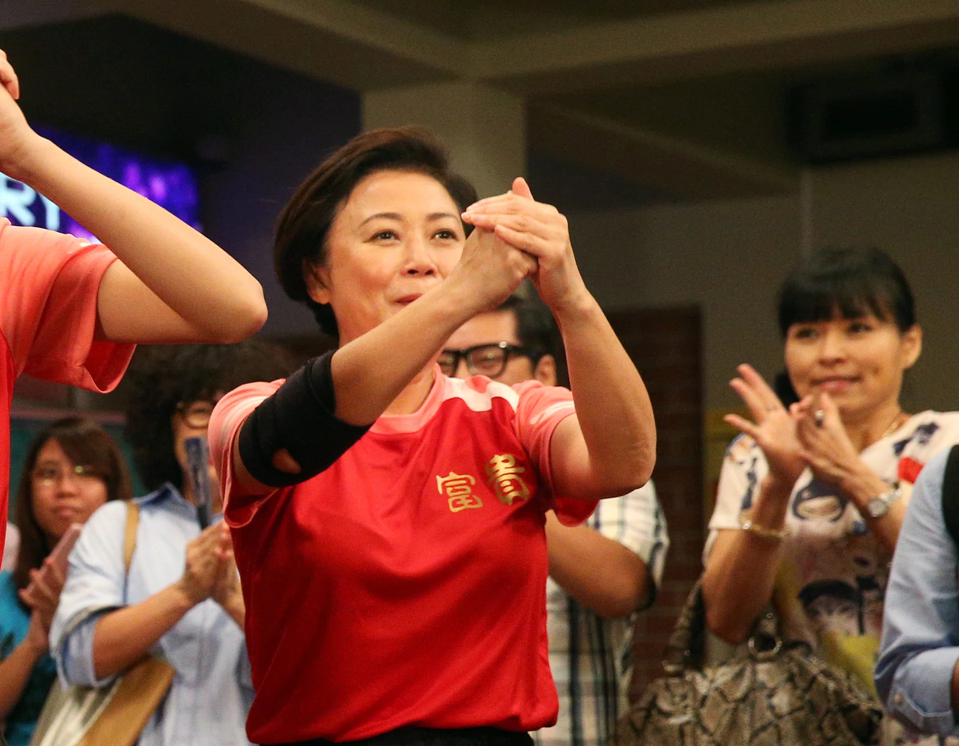 NEW SKILL: Xiang Yun (above) performs the lion dance with Julie Tan, who plays her daughter, in new drama Peace And Prosperity.