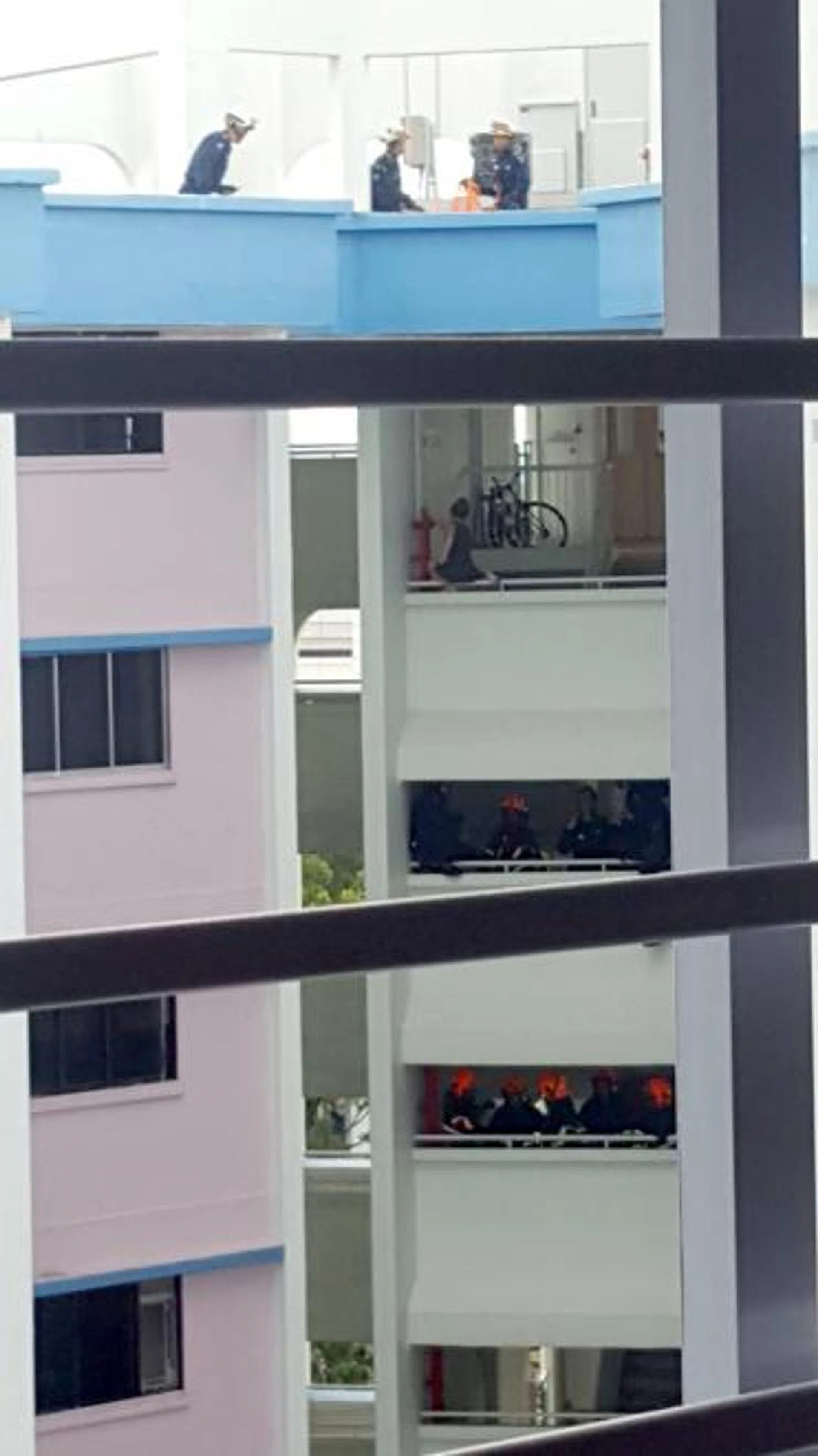 The woman spent more than two hours on the parapet. 