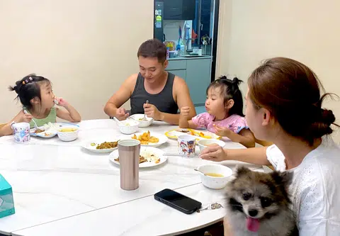 Mr Darren Tan tries to have dinner with his family every night, spending time with his two young daughters, before he goes back to work till about midnight.