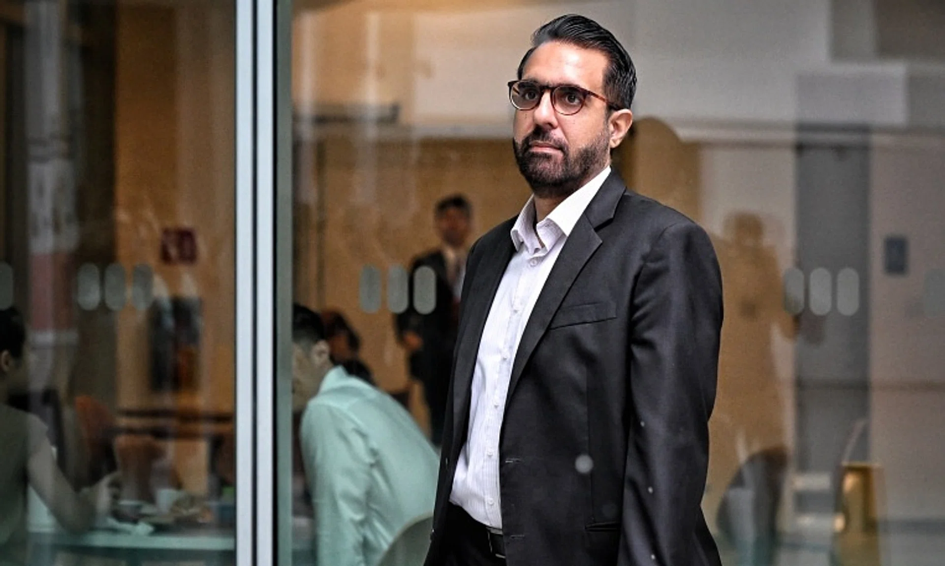 Workers' Party chief Pritam Singh arriving at the State Courts for his trial on Nov 8.