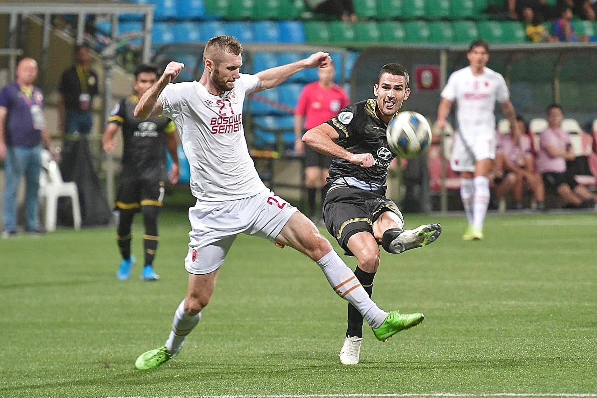Tampines Rovers striker Boris Kopitovic (in black) battling with PSM Makassar's Serif Hasic in their AFC Cup Group H opener yesterday. 