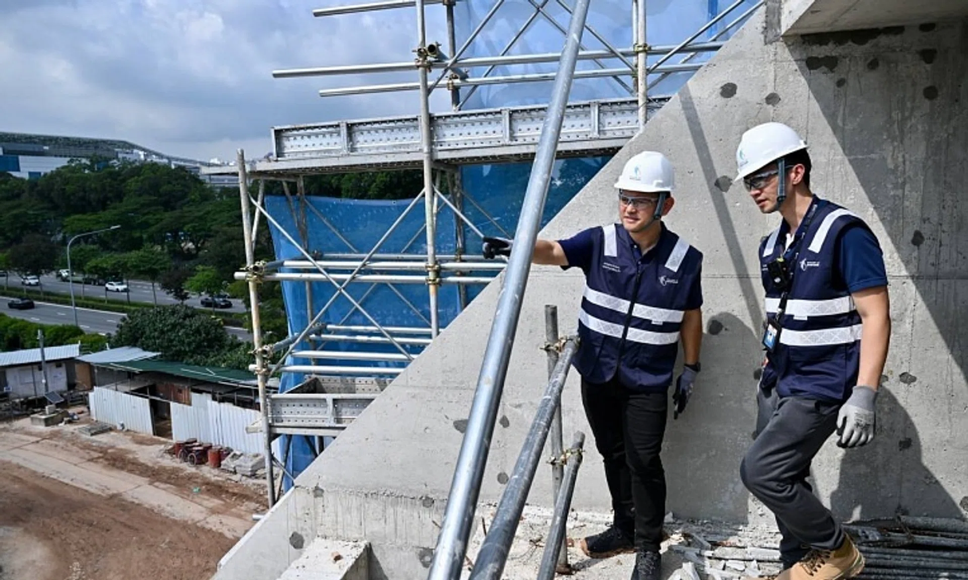 The Ministry of Manpower's Occupational Safety and Health Division officers conducting a safety inspection in Ang Mo Kio Avenue 5 on Nov 7.