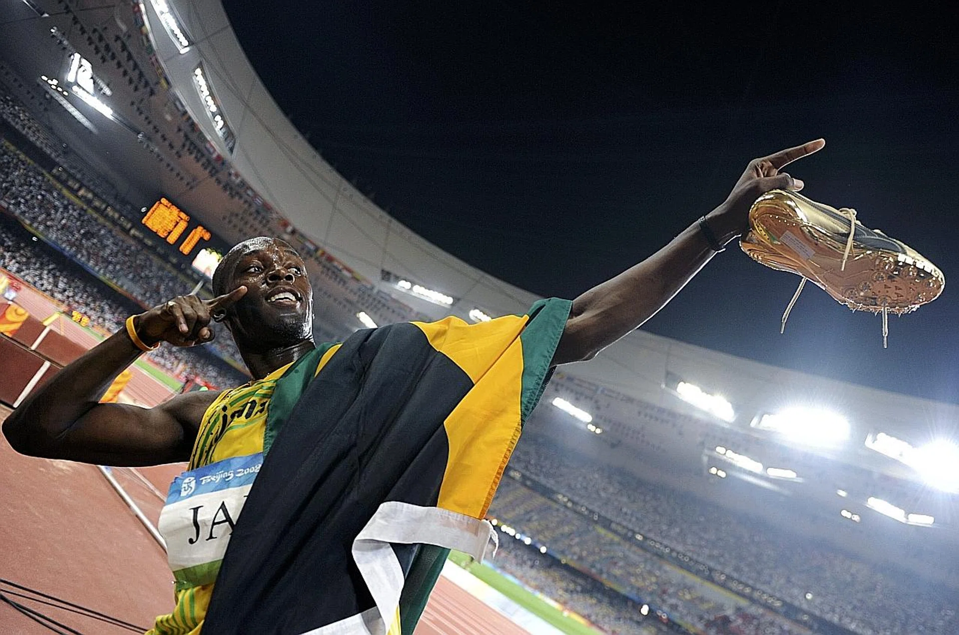 Usain Bolt of Jamaica celebrating after his team won the men's 4x100m relay final during the Beijing 2008 Olympic Games. Bolt has lost one of his nine Olympic gold medals after Jamaica teammate Nesta Carter was found guilty of doping. 