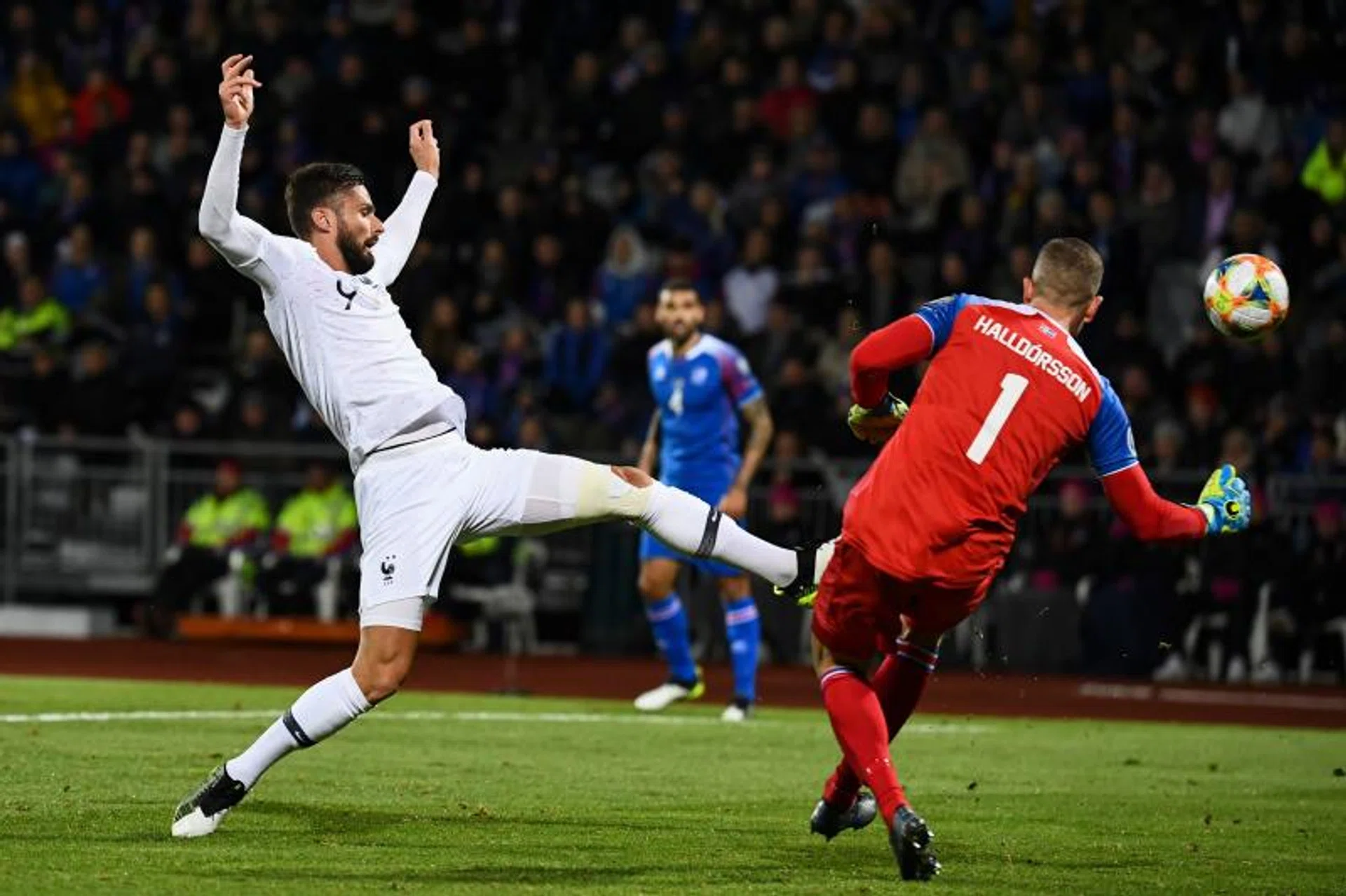 France's Olivier Giroud (left) challenging for the ball with Iceland goalkeeper Hannes Halldorsson.