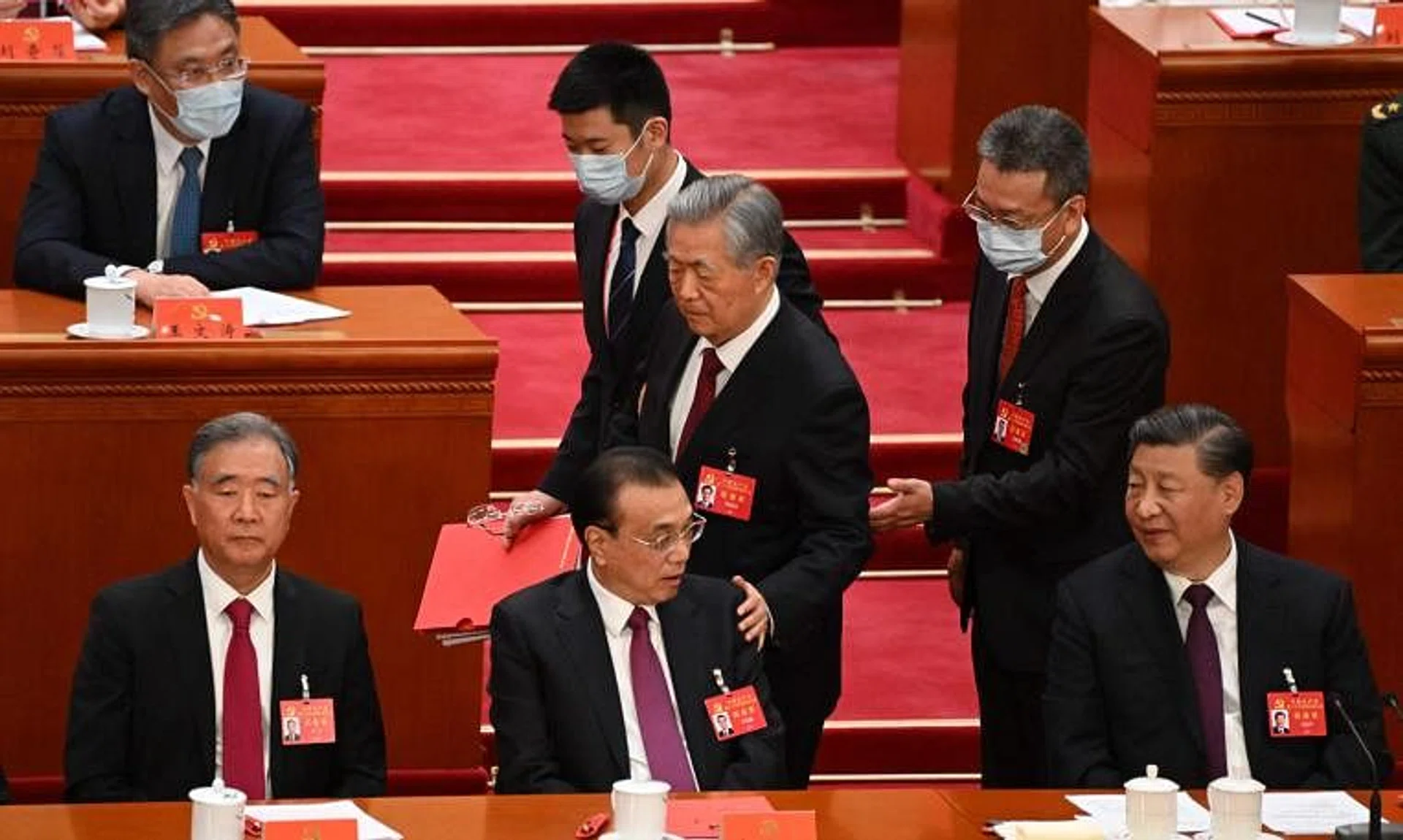 Mr Hu had been unexpectedly escorted off the stage at the Great Hall of the People in Beijing during the closing ceremony. 