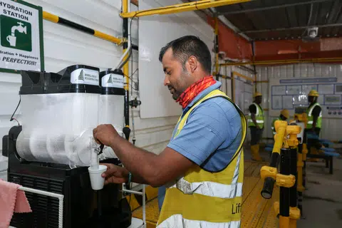 Vico Construction lifting supervisor Rakibujjaman Mohammad pouring himself an ice slushie at the Central Weave @ AMK construction site on April 4.