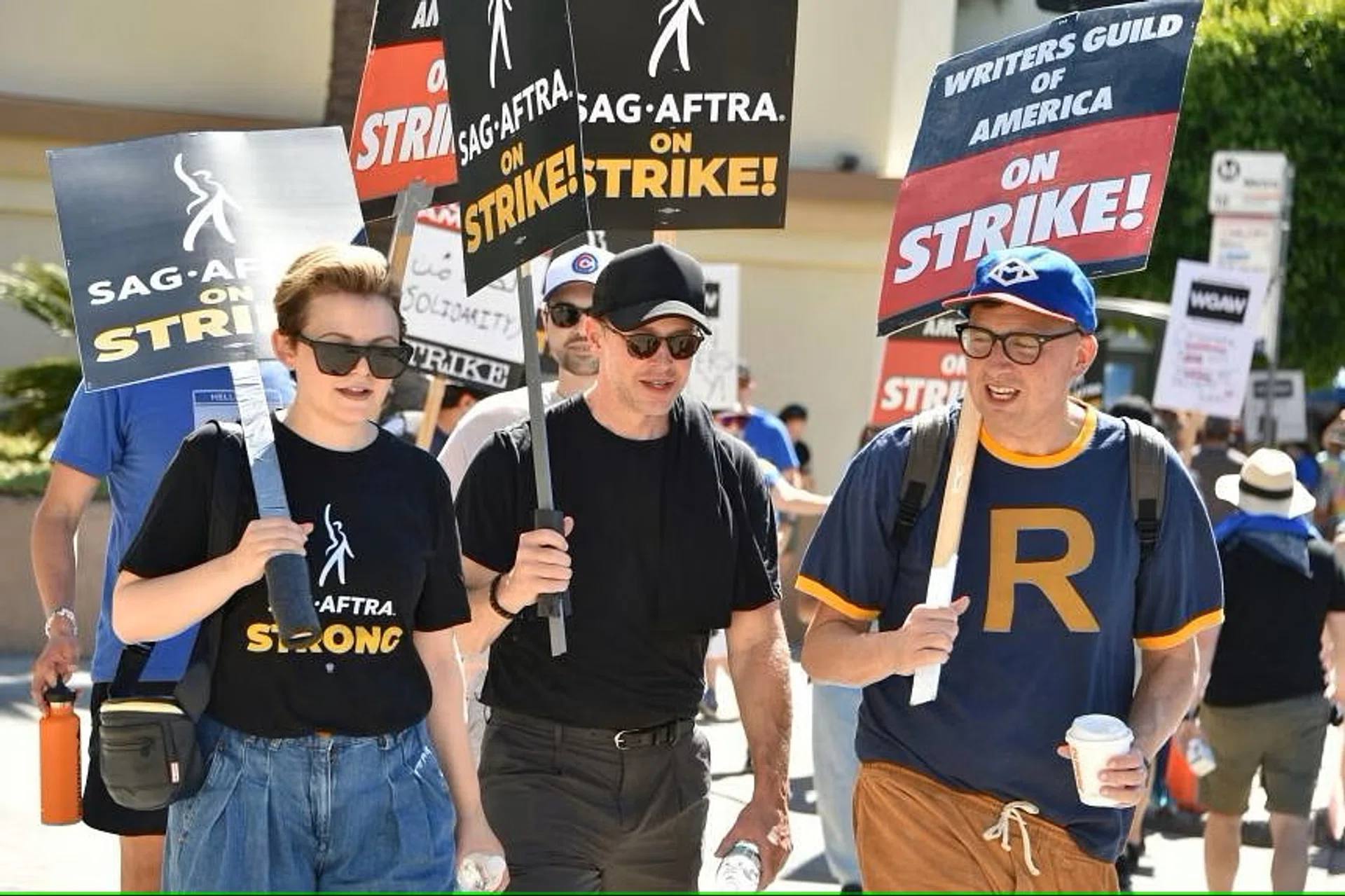US actress Ginnifer Goodwin (left) joins striking writers outside Paramount Pictures studios in Los Angeles, California. 