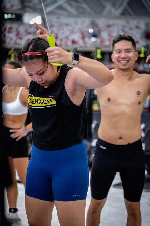 Mr Richmond Loo cheering his wife, breast cancer survivor Selene Zhang, at the AIA Hyrox Open Asian Championships in June. 