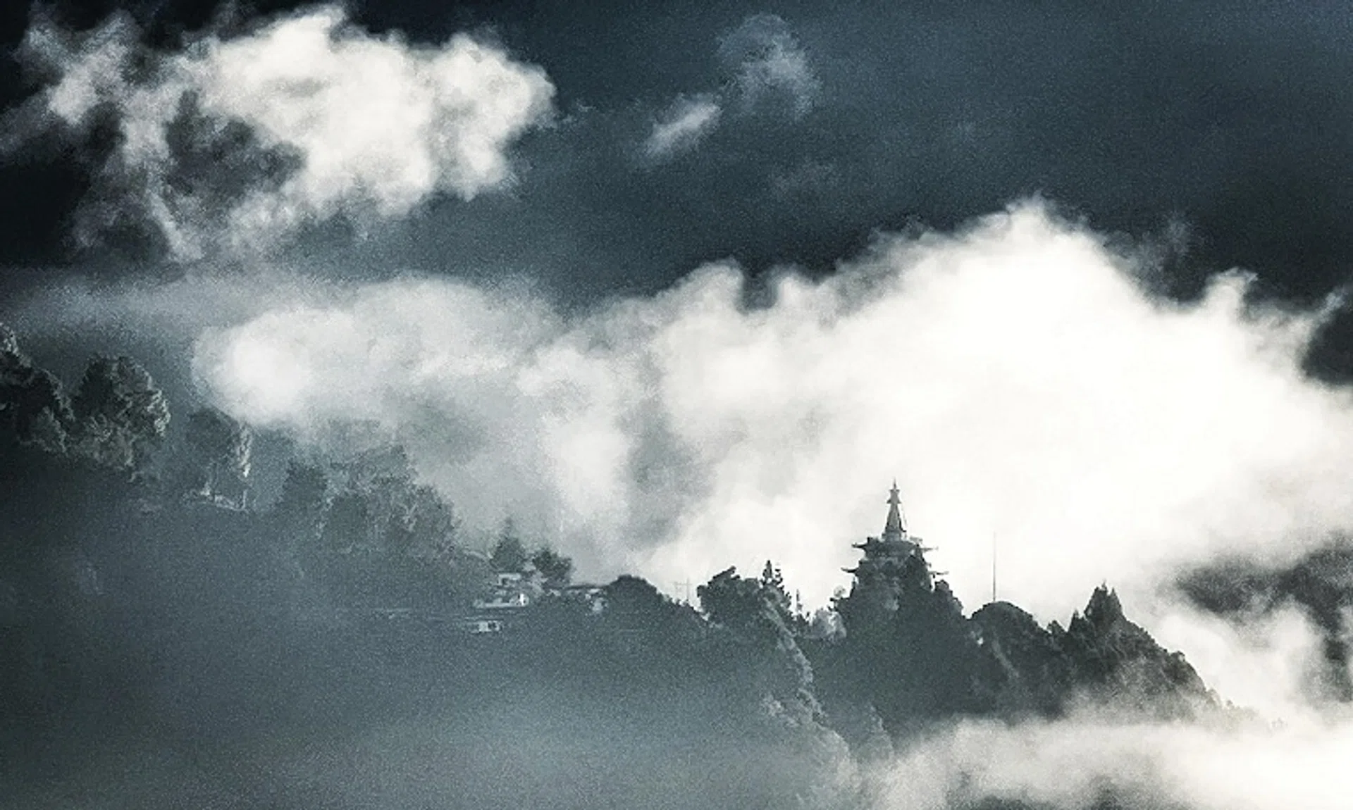 I took this photo from the Como Punakha, Bhutan, in 2021. As the world continued to battle Covid-19, I found myself spending the last day of 2021 and the first day of 2022 here in quiet contemplation. This is the view of Khamsum Valley Namgyal Chorten. This sanctuary in the clouds stands as a beacon of peace. It overlooks the breathtaking Punakha Valley in Bhutan.