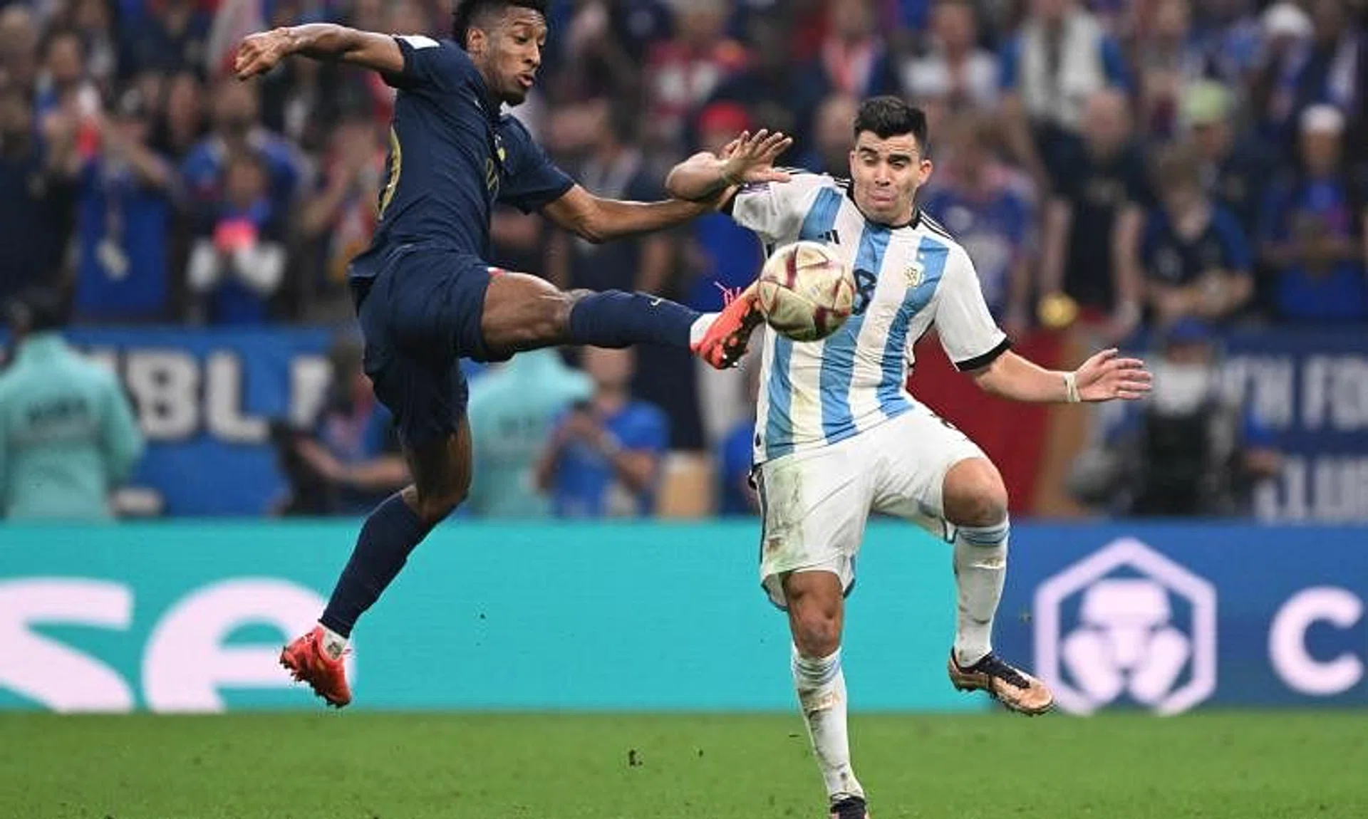 France forward Kingsley Coman fights for the ball with Argentina defender Marcos Acuna during the World Cup final.
