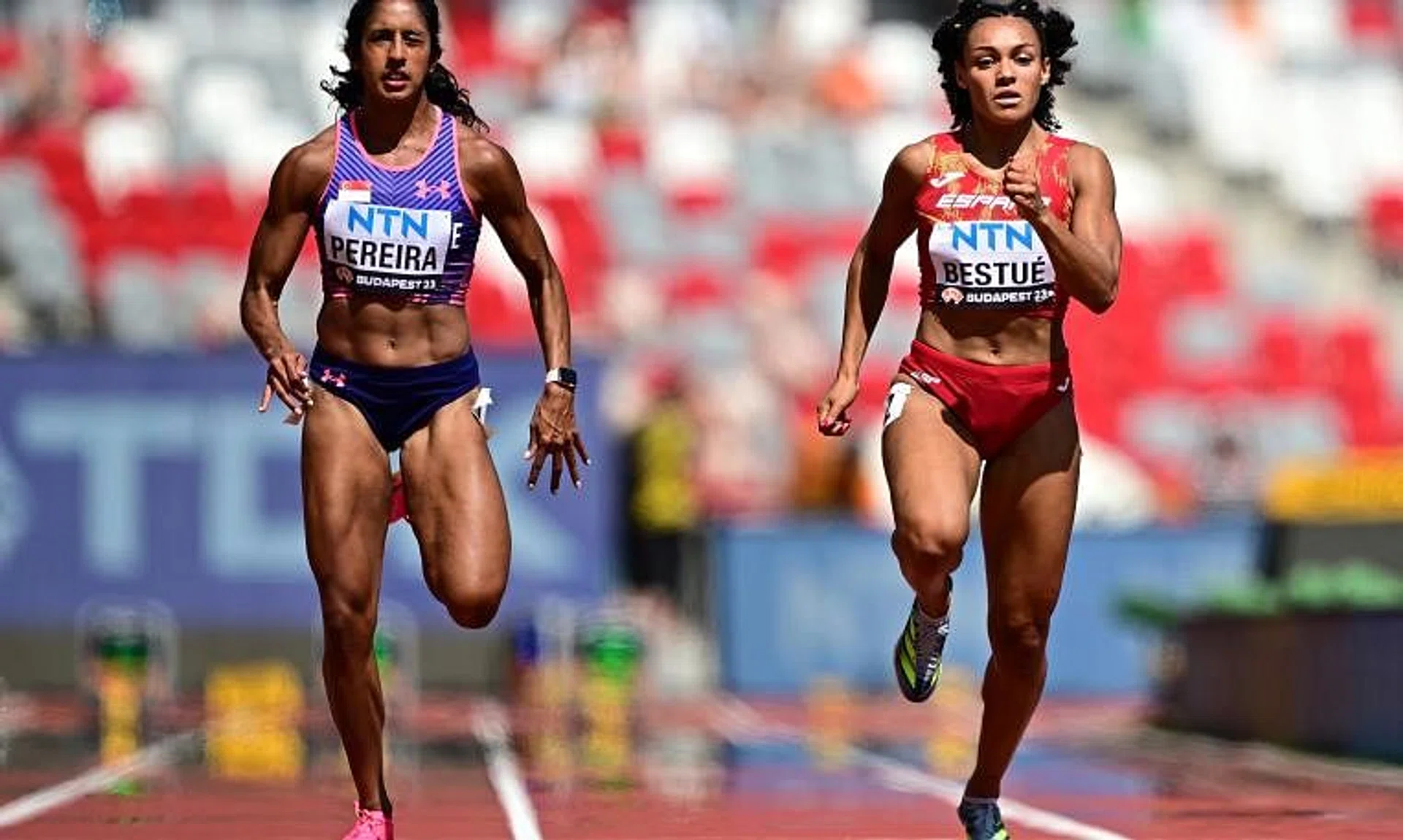 Shanti Pereira (left) is beaten by Spain's Jael Bestue to third in their 100m heats at the World Athletics Championships.