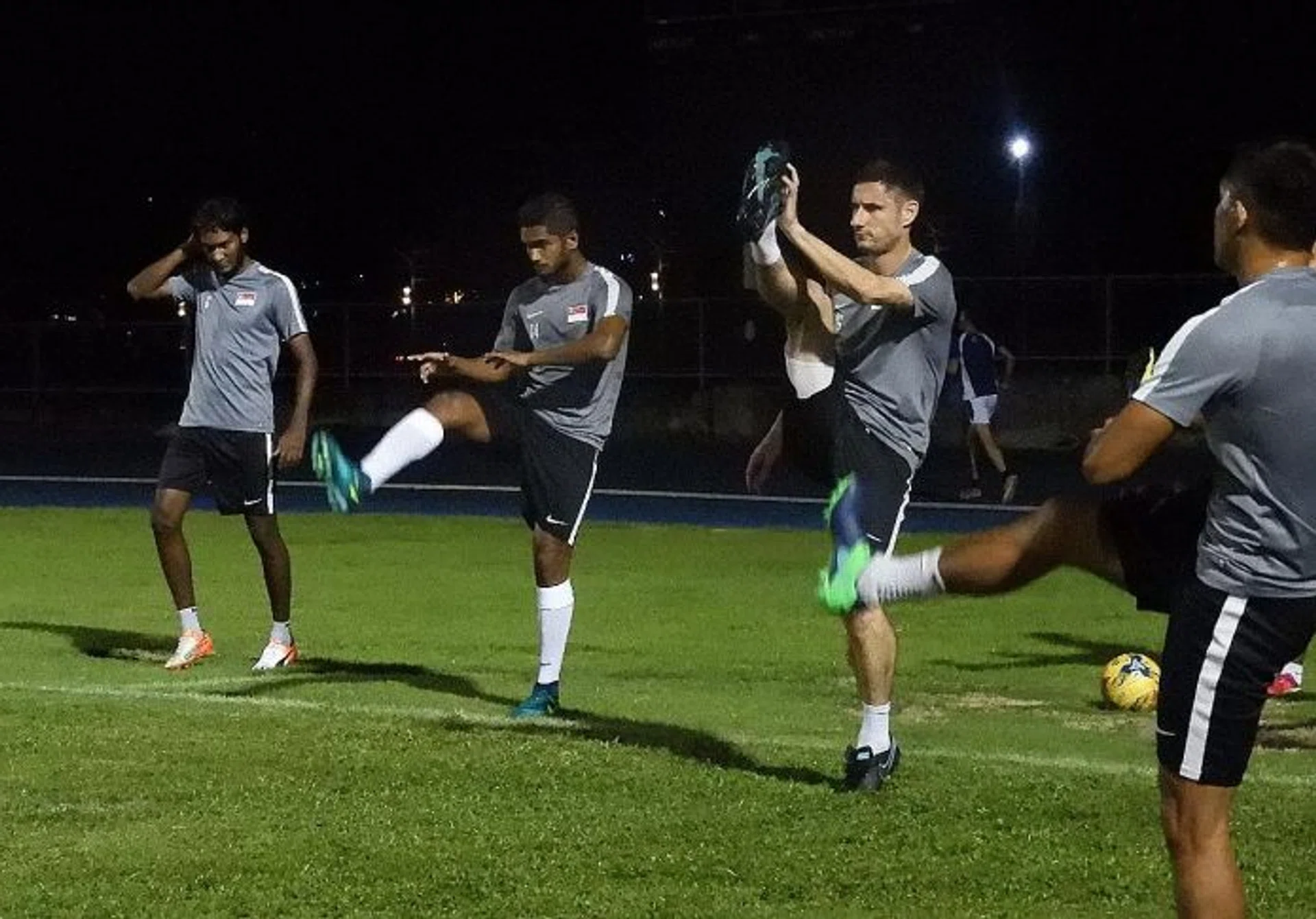 BEST FOOT FORWARD: Lions (from far left) Madhu Mohana, Hariss Harun and Daniel Bennett limbering up during their training session in Manila last night.  