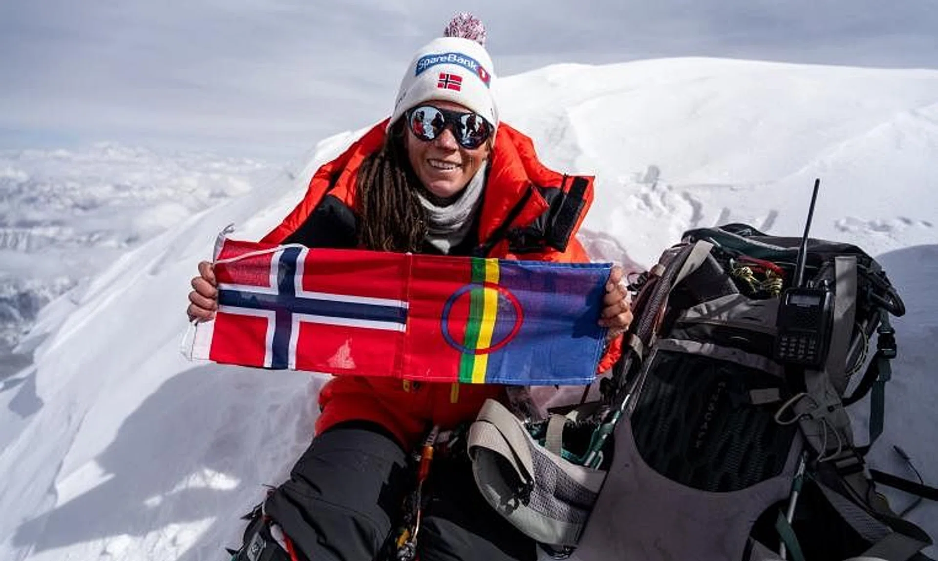 Norwegian climber Kristin Harila with her country flag at Shishapangma, the 14th-highest mountain in the world, in China.