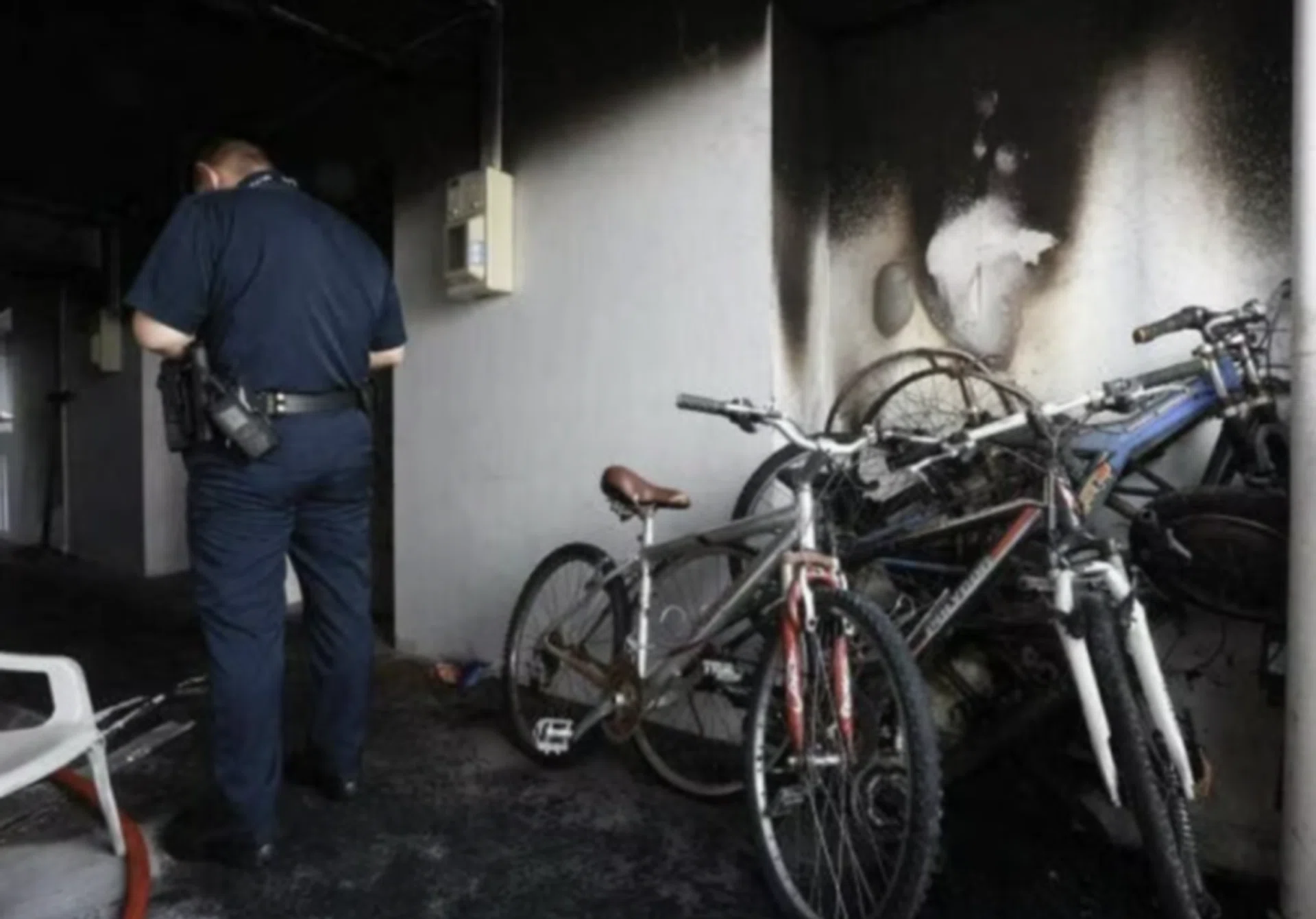 The blackened walls and ceiling of the corridor where the fire broke out.